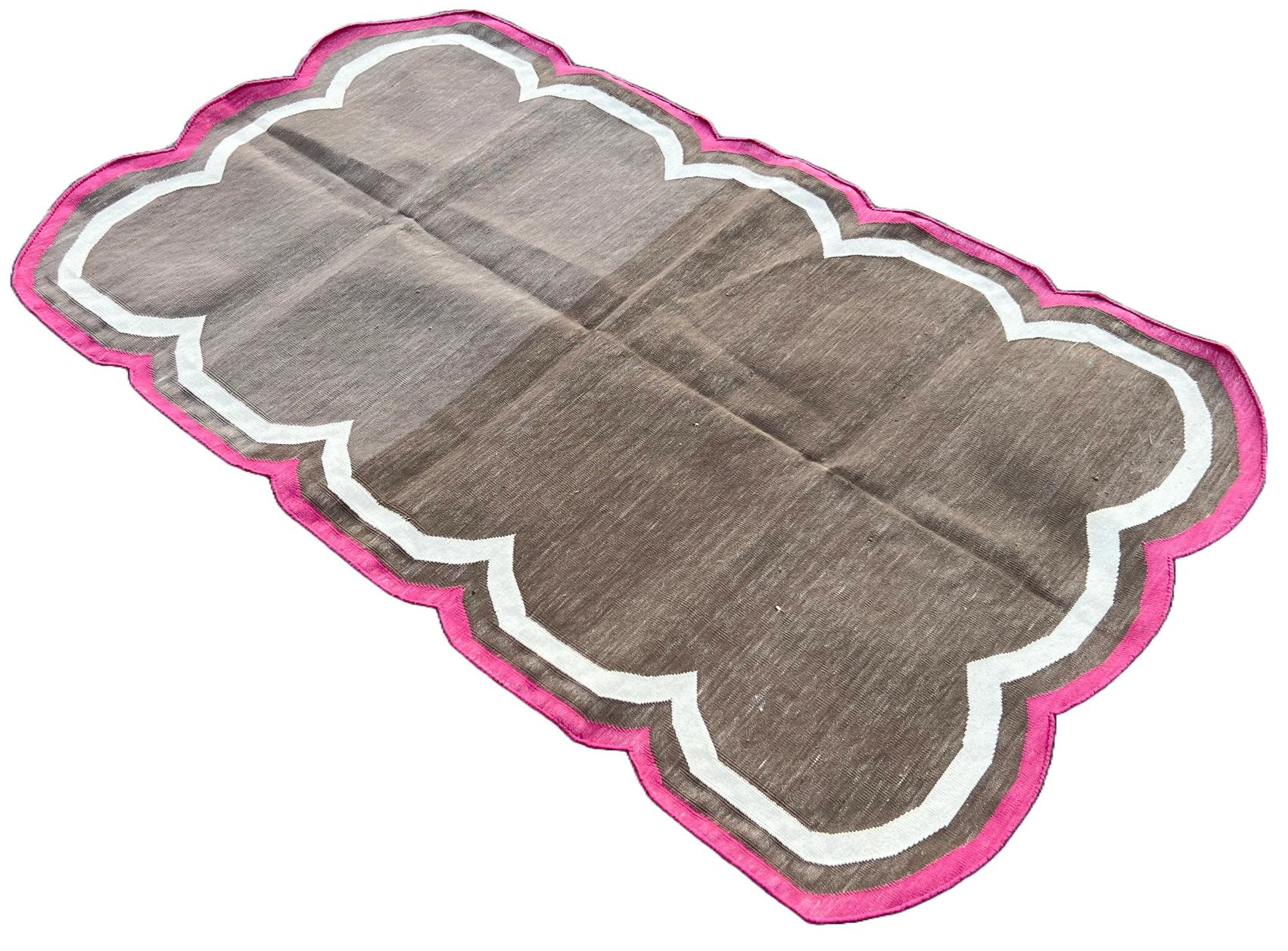Cotton Vegetable Dyed Brown, Cream And Raspberry Pink Four Sided Scalloped Rug-3'x5' 
(Scallops runs on all Four Sides)
These special flat-weave dhurries are hand-woven with 15 ply 100% cotton yarn. Due to the special manufacturing techniques used