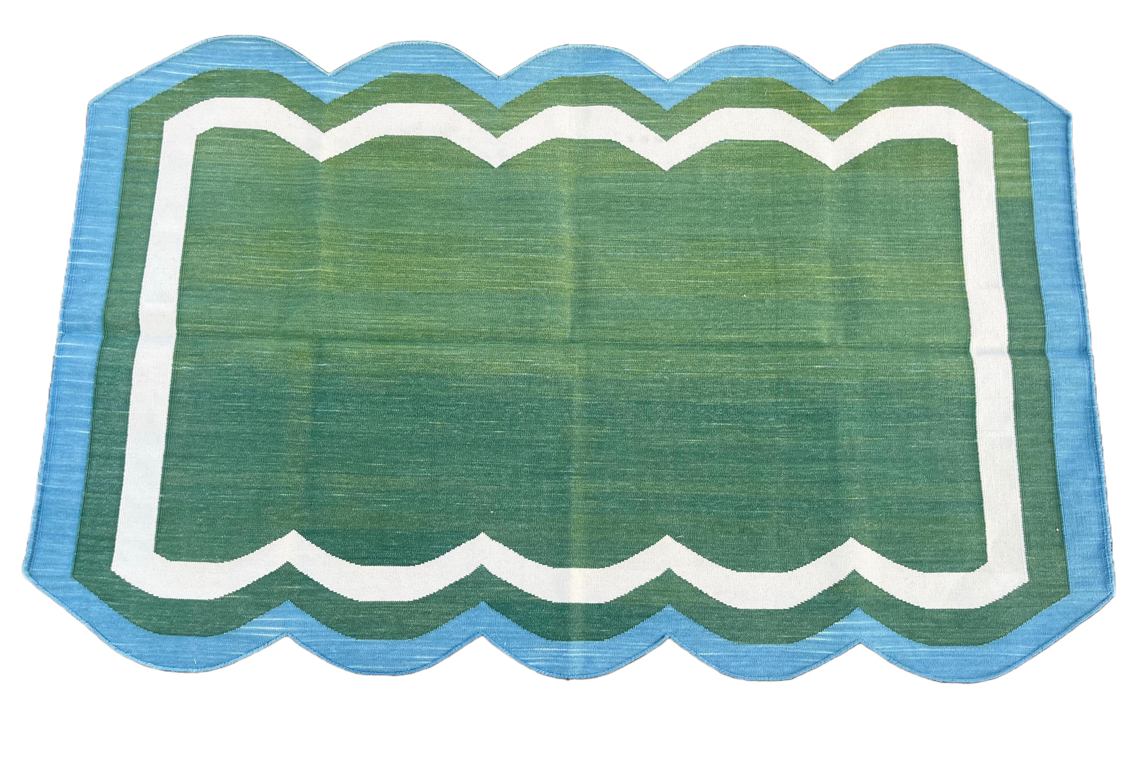 Cotton Vegetable Dyed Forest Green, Cream And Teal Blue Two Sided Scalloped Rug-3'x5' 
(Scallops runs on all 5 Feet Sides)
These special flat-weave dhurries are hand-woven with 15 ply 100% cotton yarn. Due to the special manufacturing techniques