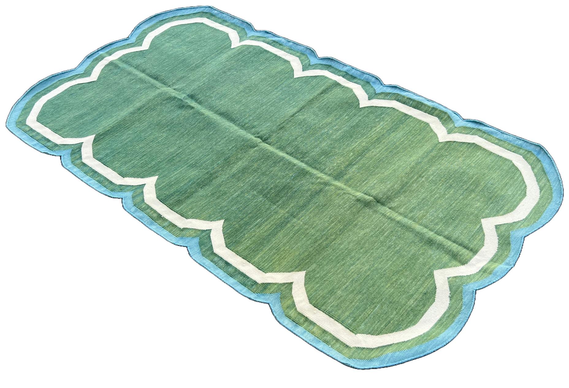 Cotton Vegetable Dyed Forest Green, Cream And Teal Blue Two Sided Scalloped Rug-3'x5' 
(Scallops runs on all Four Sides)
These special flat-weave dhurries are hand-woven with 15 ply 100% cotton yarn. Due to the special manufacturing techniques used