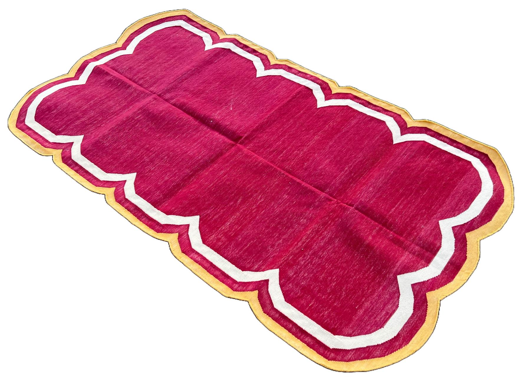 Cotton Vegetable Dyed Raspberry Pink, Cream And Yellow Four Sided Scalloped Rug-3'x5' 
(Scallops runs on all Four Sides)
These special flat-weave dhurries are hand-woven with 15 ply 100% cotton yarn. Due to the special manufacturing techniques used