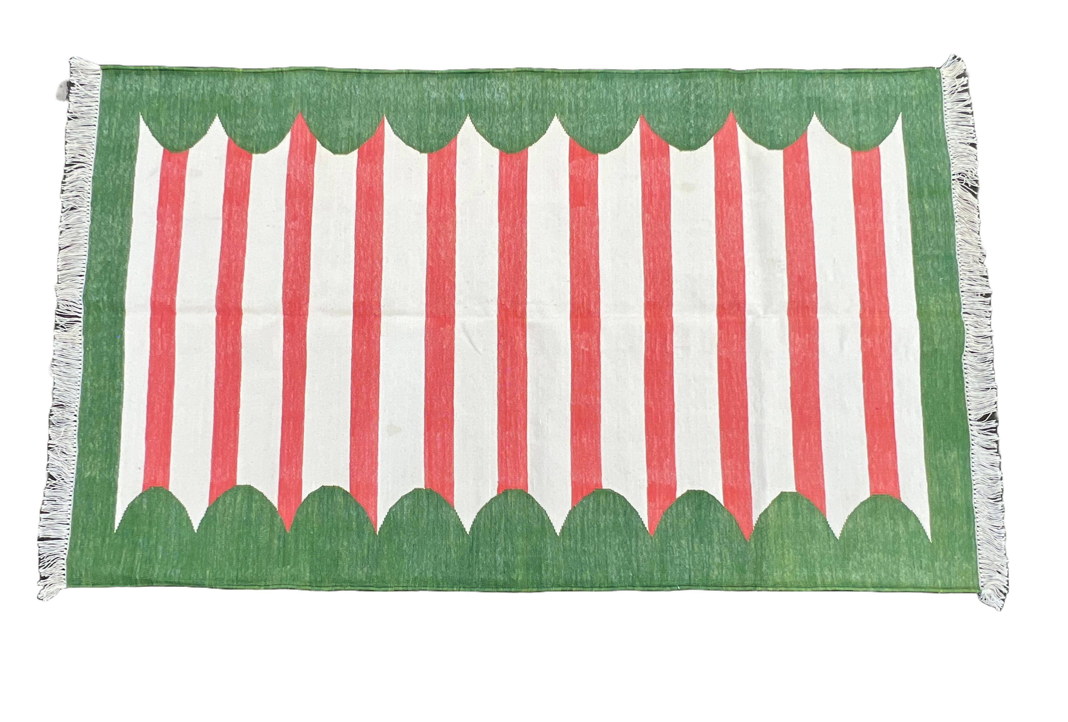 Cotton Natural Vegetable Dyed Cream, Red And Green Scalloped Striped Indian Rug-3'x5'

These special flat-weave dhurries are hand-woven with 15 ply 100% cotton yarn. Due to the special manufacturing techniques used to create our rugs, the size and