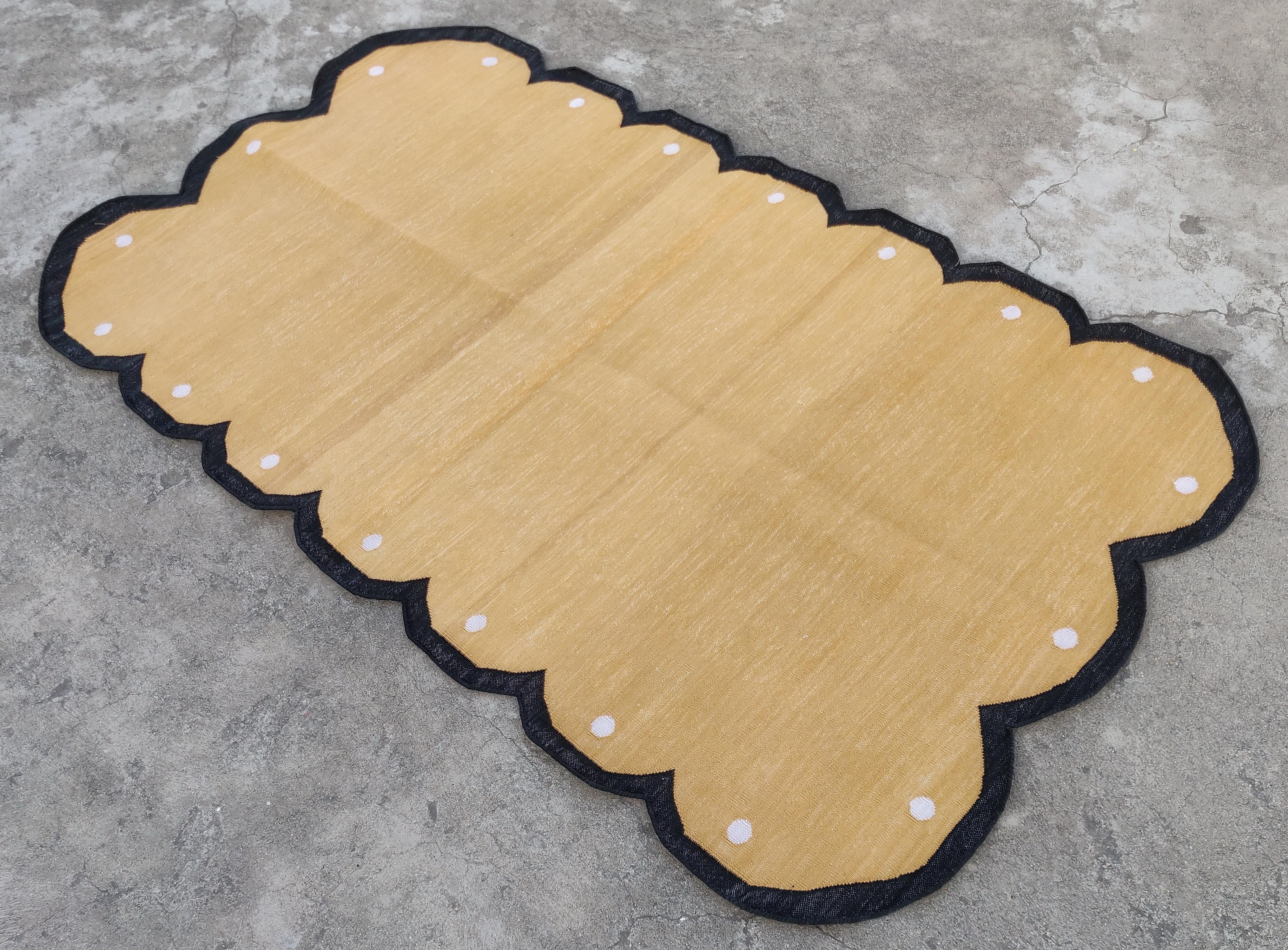 Cotton Vegetable Dyed Mustard, Cream And Black Scalloped Indian Dhurrie Rug-3'x5' (Scallops runs on all four sides)

These special flat-weave dhurries are hand-woven with 15 ply 100% cotton yarn. Due to the special manufacturing techniques used to