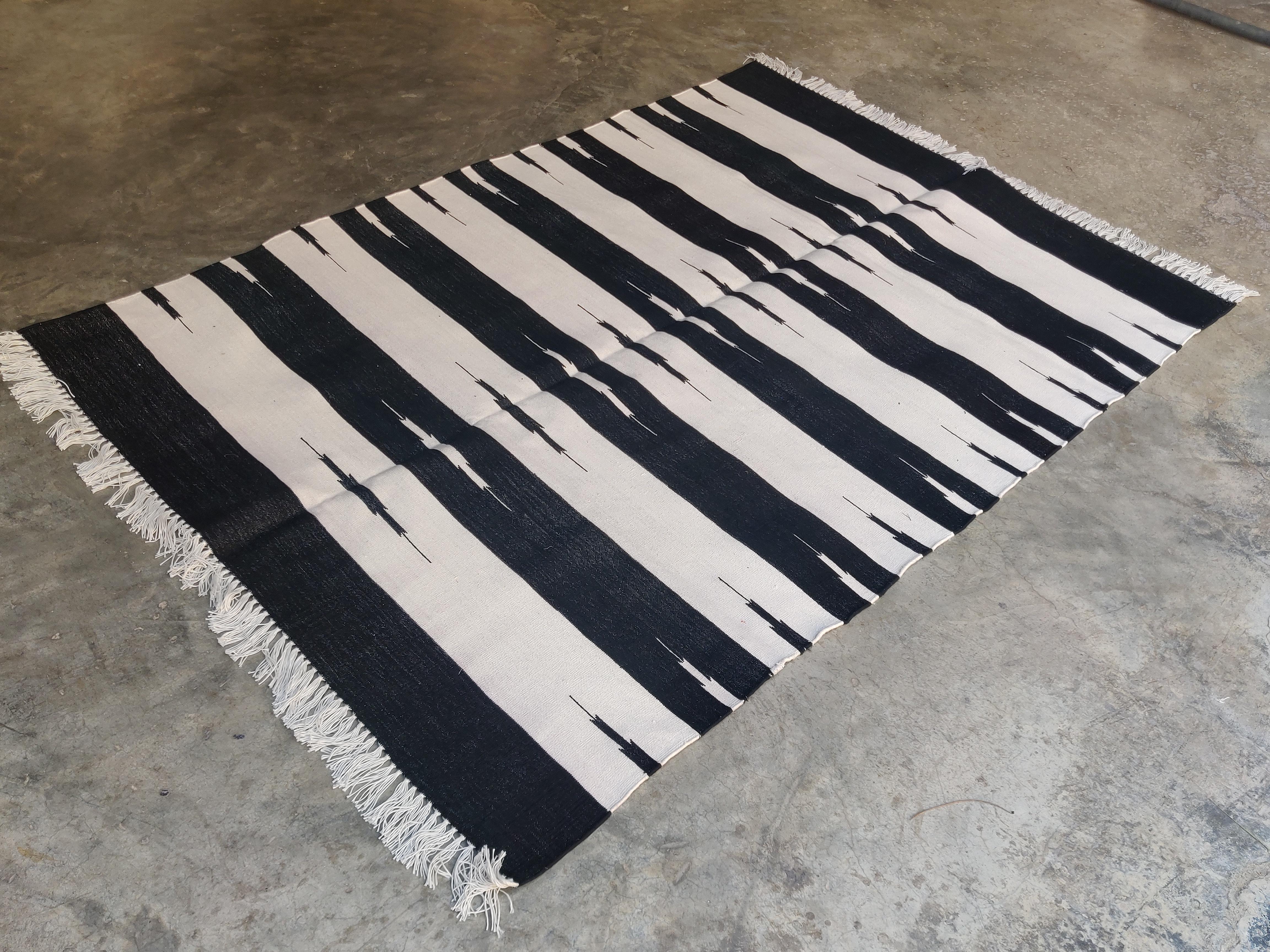 Cotton Vegetable Dyed Black And White Striped Indian Dhurrie Rug-4'x6' 

These special flat-weave dhurries are hand-woven with 15 ply 100% cotton yarn. Due to the special manufacturing techniques used to create our rugs, the size and color of each