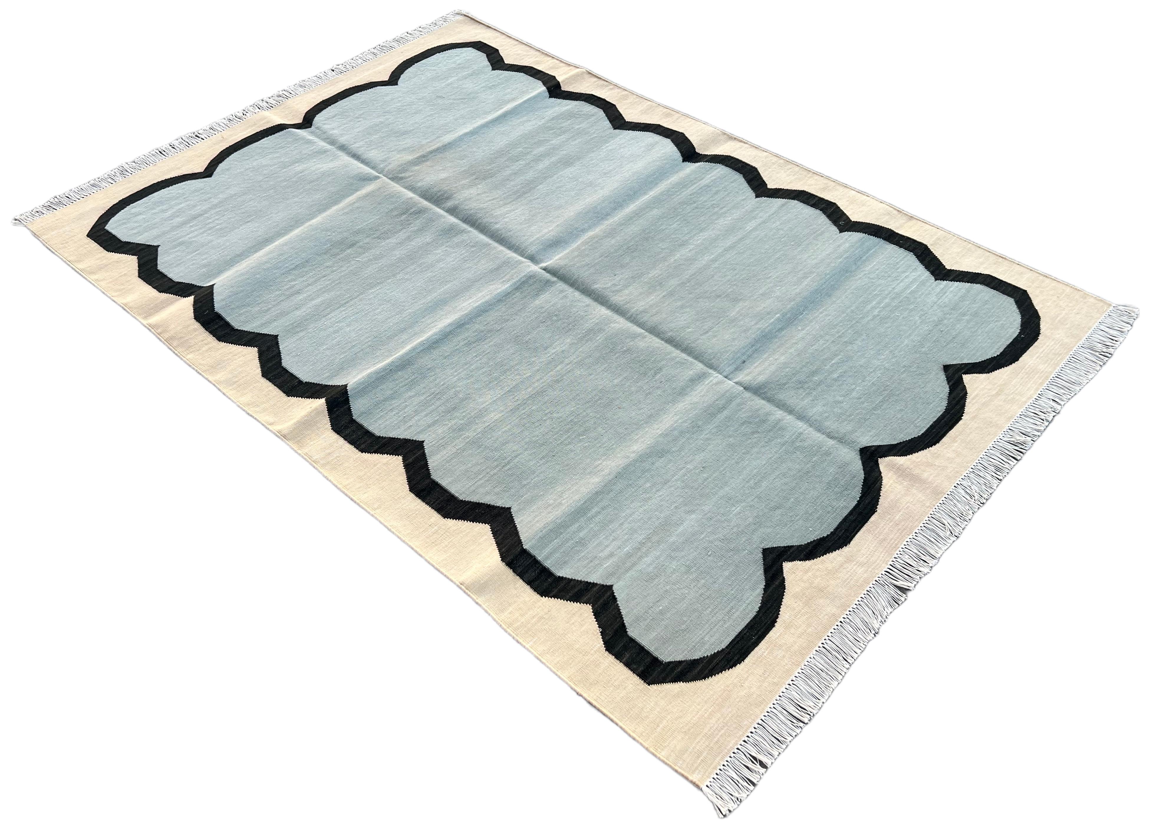 Cotton Natural Vegetable Dyed, Blue, Black And Cream Scalloped Striped Indian Rug - 4'x6'
These special flat-weave dhurries are hand-woven with 15 ply 100% cotton yarn. Due to the special manufacturing techniques used to create our rugs, the size