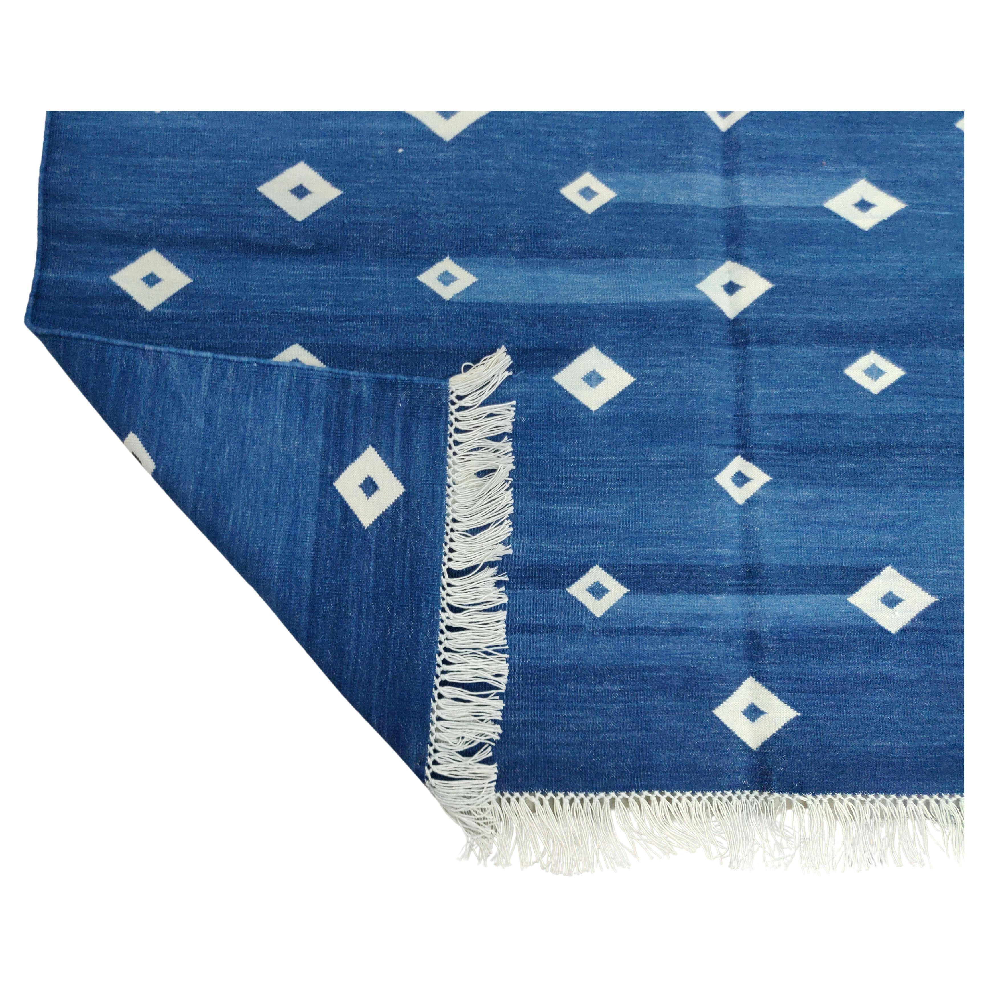 Cotton Vegetable Dyed Indigo Blue and White Diamond Indian Dhurrie Rug-4'x6' 

These special flat-weave dhurries are hand-woven with 15 ply 100% cotton yarn. Due to the special manufacturing techniques used to create our rugs, the size and color of