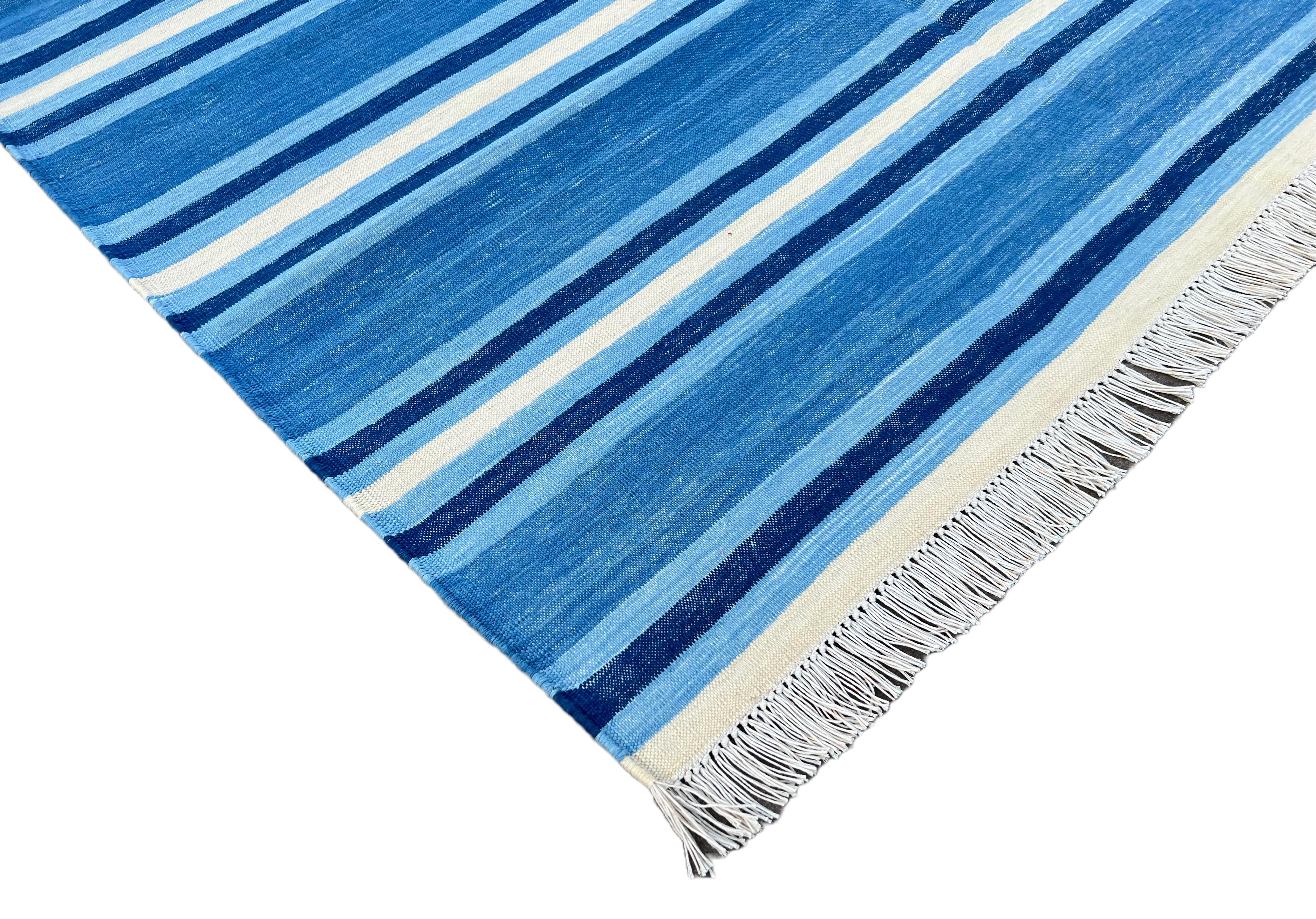 Cotton Vegetable Dyed Blue and White Striped Indian Dhurrie Rug-4'x6' 

These special flat-weave dhurries are hand-woven with 15 ply 100% cotton yarn. Due to the special manufacturing techniques used to create our rugs, the size and color of each