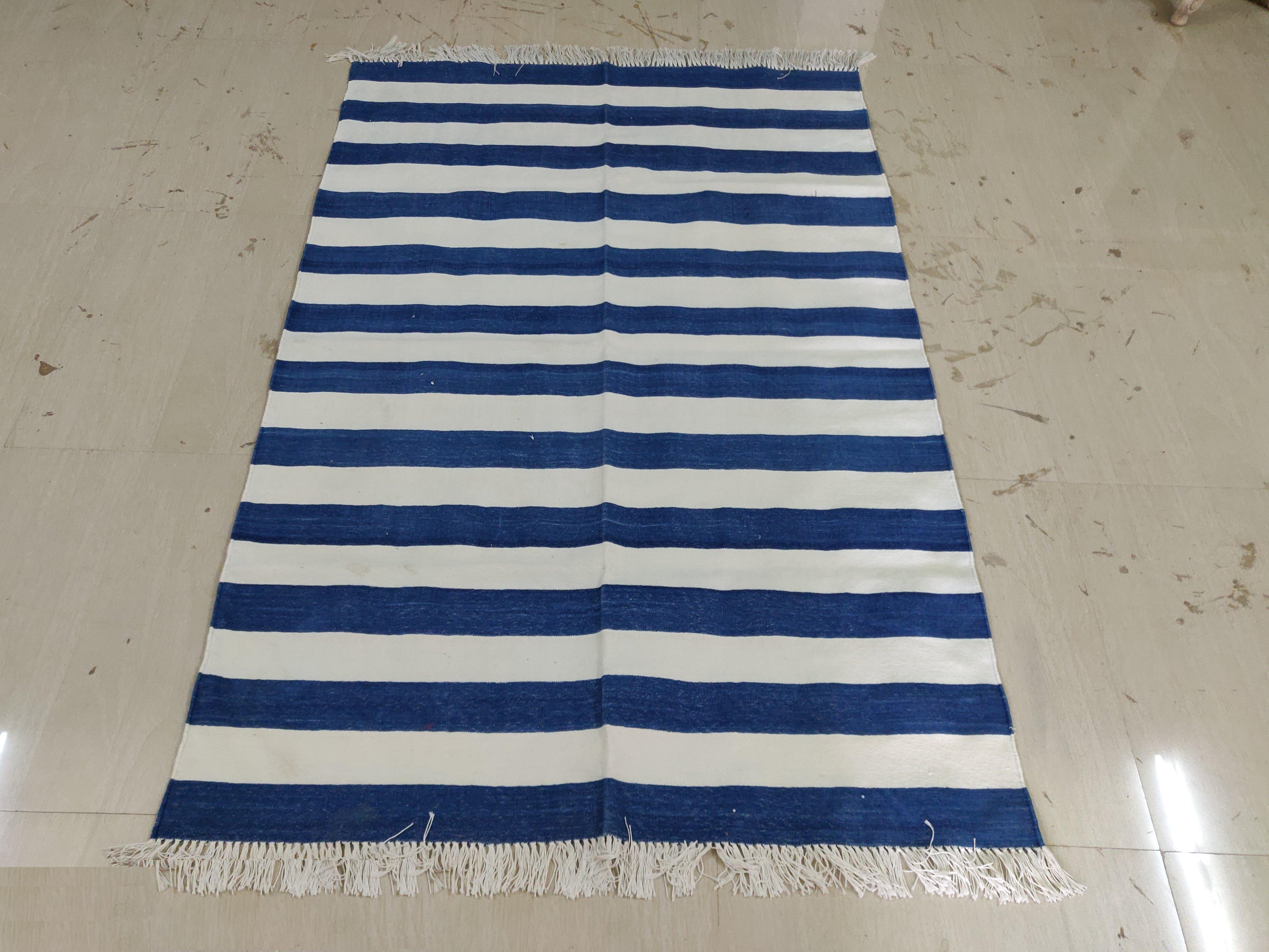 Cotton Vegetable Dyed Indigo Blue and White Striped Indian Dhurrie Rug-4'x6' 

These special flat-weave dhurries are hand-woven with 15 ply 100% cotton yarn. Due to the special manufacturing techniques used to create our rugs, the size and color of