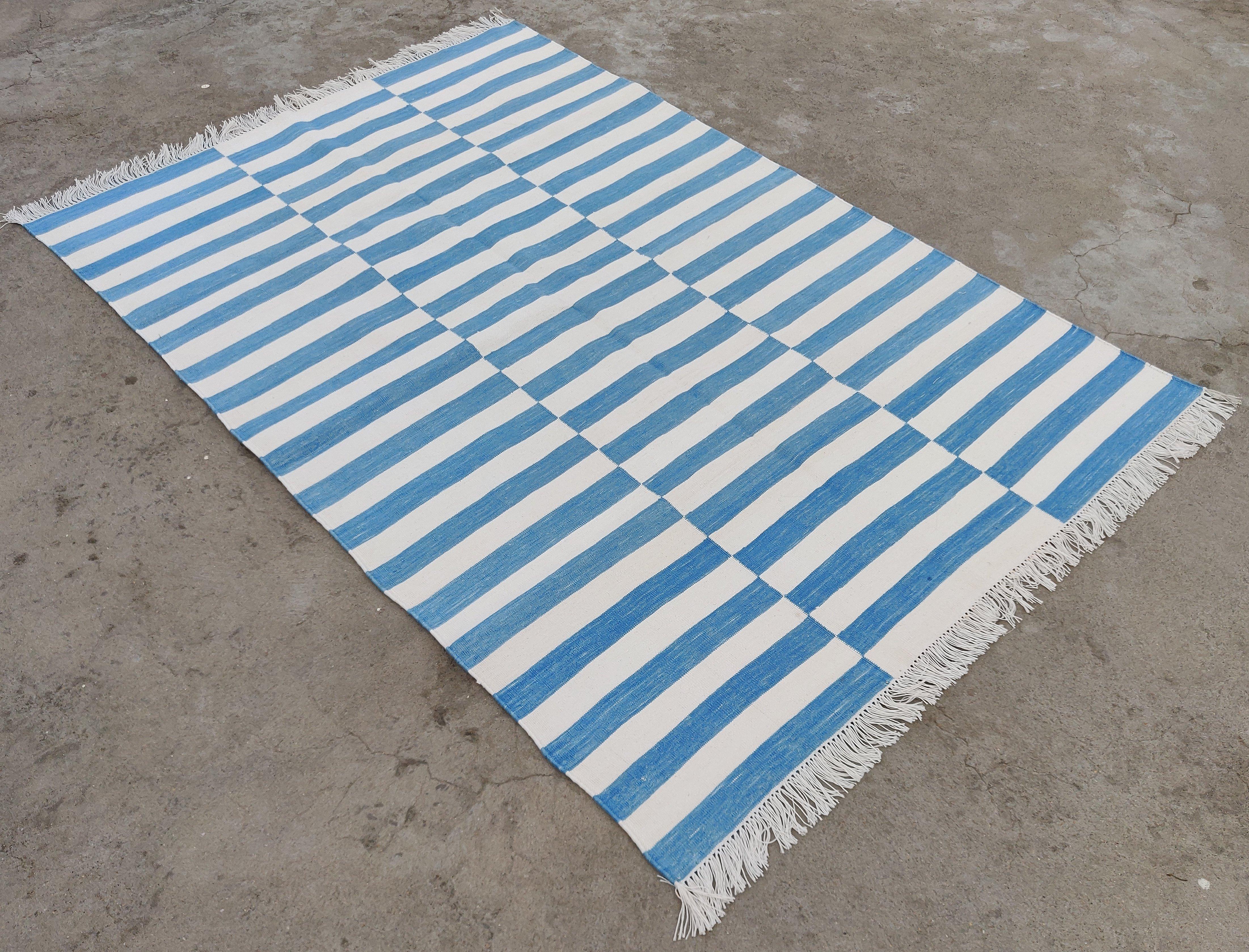 Cotton Vegetable Dyed Sky Blue and White Striped Indian Dhurrie Rug-4'x6' 

These special flat-weave dhurries are hand-woven with 15 ply 100% cotton yarn. Due to the special manufacturing techniques used to create our rugs, the size and color of