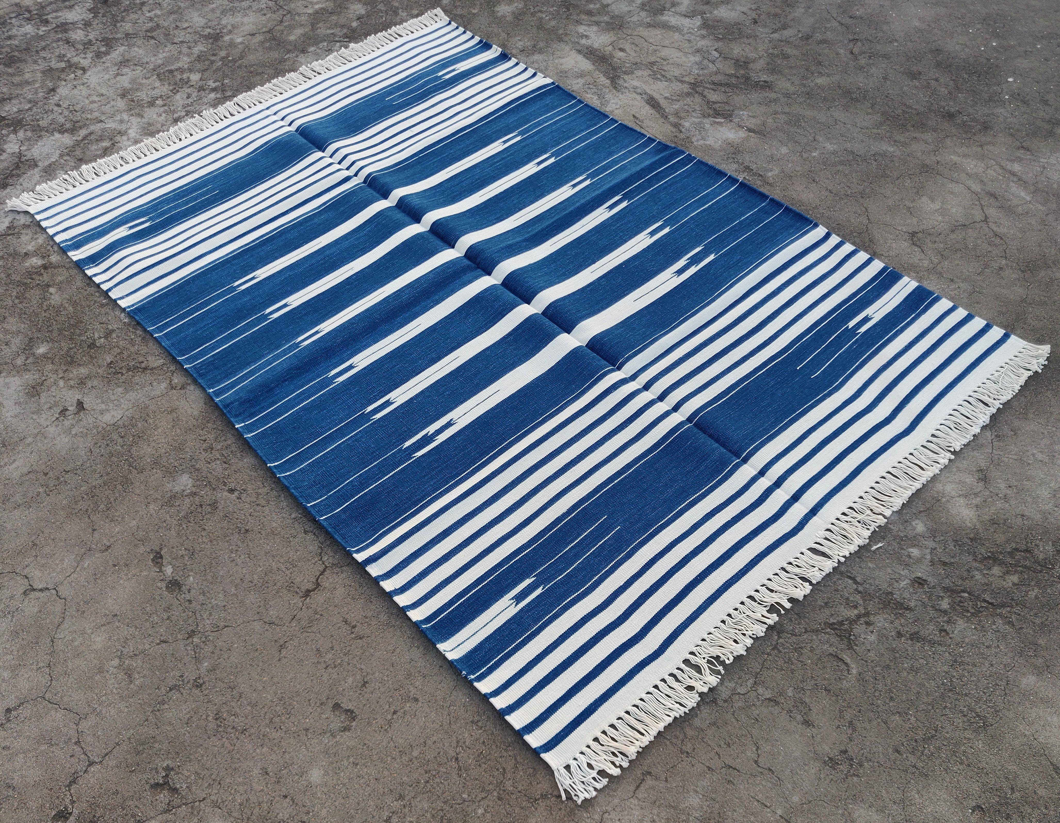 Cotton Vegetable Dyed Indigo Blue and White Striped Indian Dhurrie Rug-4'x6' 

These special flat-weave dhurries are hand-woven with 15 ply 100% cotton yarn. Due to the special manufacturing techniques used to create our rugs, the size and color of
