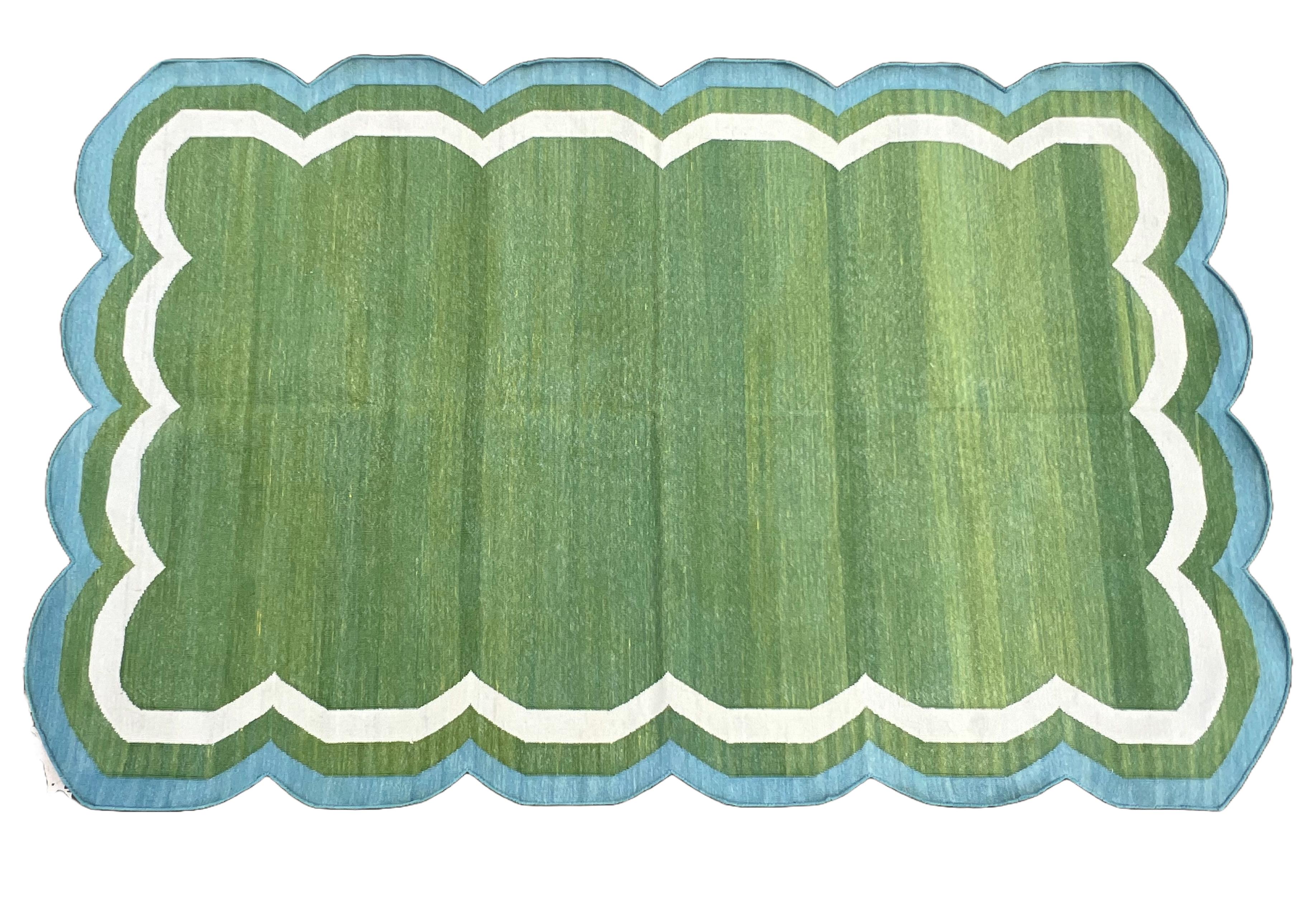 Cotton Vegetable Dyed Moss Green, Cream and Teal Blue Four Sided Scalloped Rug-4'x6' (120x180cm)

These special flat-weave dhurries are hand-woven with 15 ply 100% cotton yarn. Due to the special manufacturing techniques used to create our rugs, the