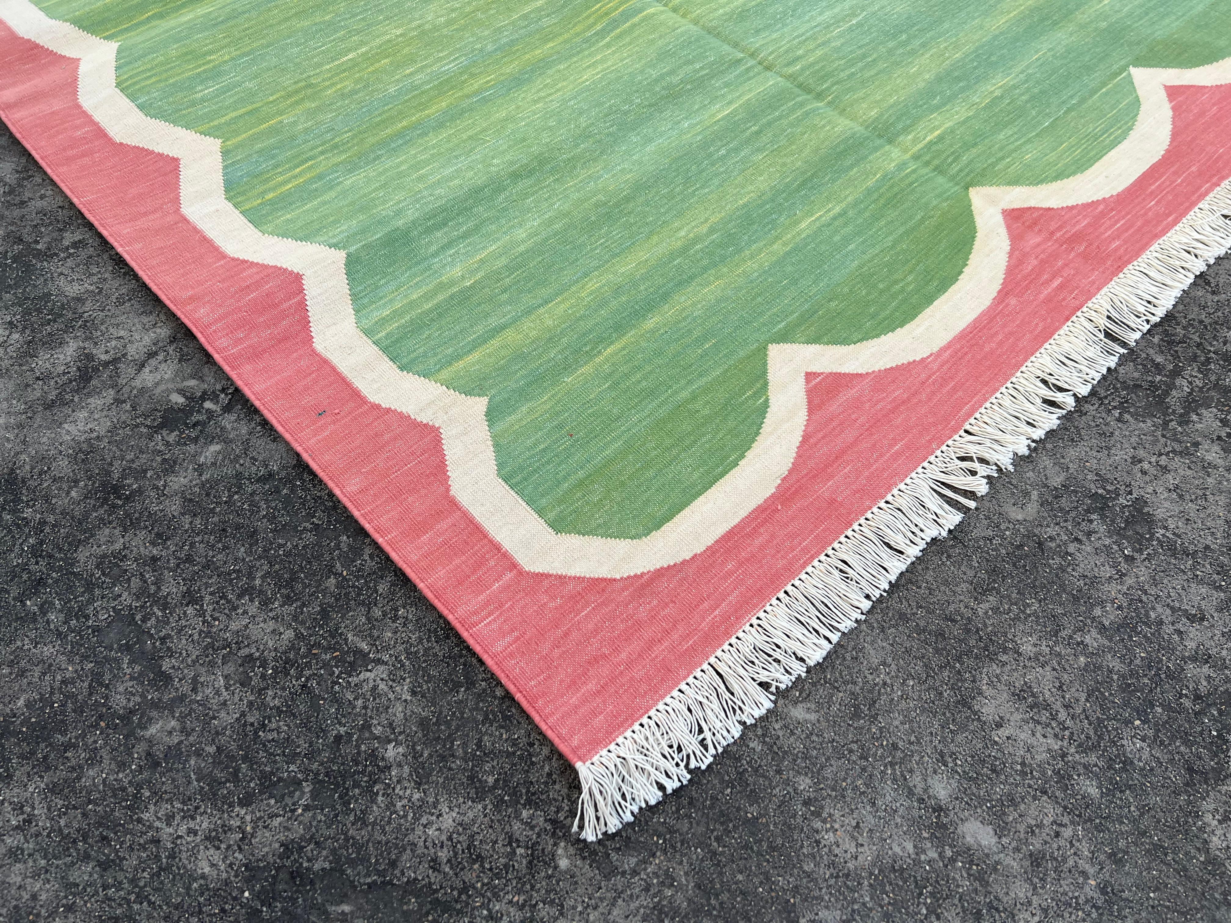 Cotton Vegetable Dyed Green and Coral Scalloped Striped Indian Dhurrie Rug-4'x6' 

These special flat-weave dhurries are hand-woven with 15 ply 100% cotton yarn. Due to the special manufacturing techniques used to create our rugs, the size and color