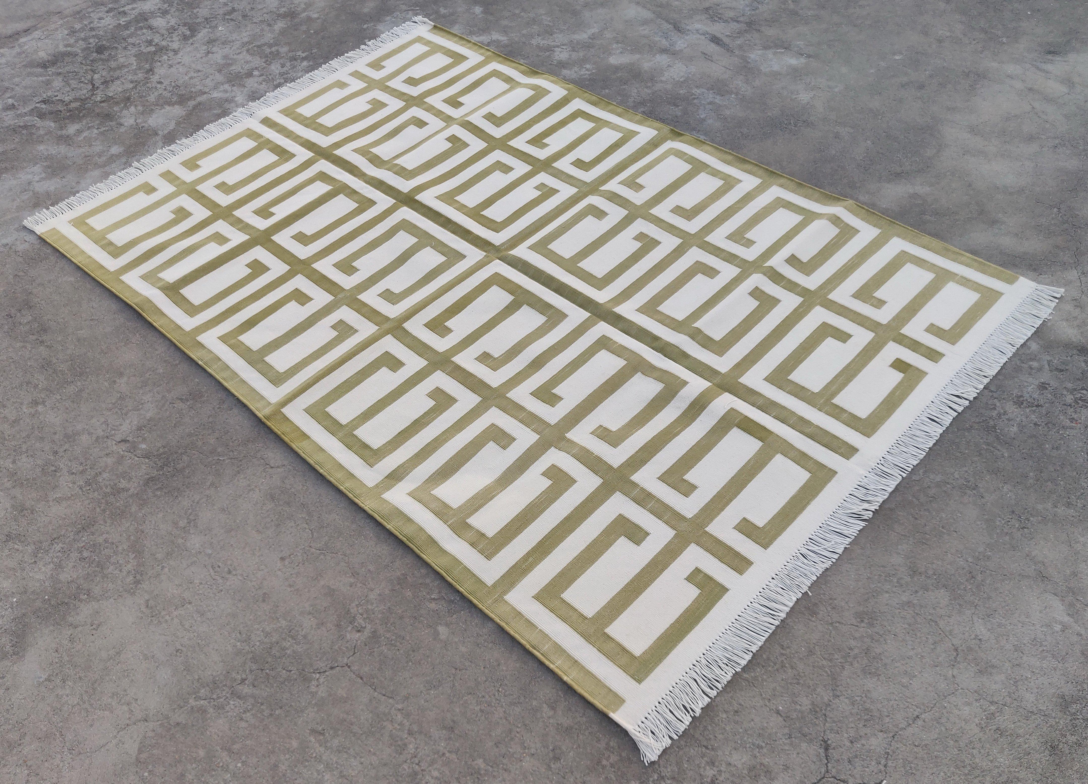 Cotton Vegetable Dyed Olive Green And White Geometric Indian Dhurrie Rug-4'x6' 

These special flat-weave dhurries are hand-woven with 15 ply 100% cotton yarn. Due to the special manufacturing techniques used to create our rugs, the size and color