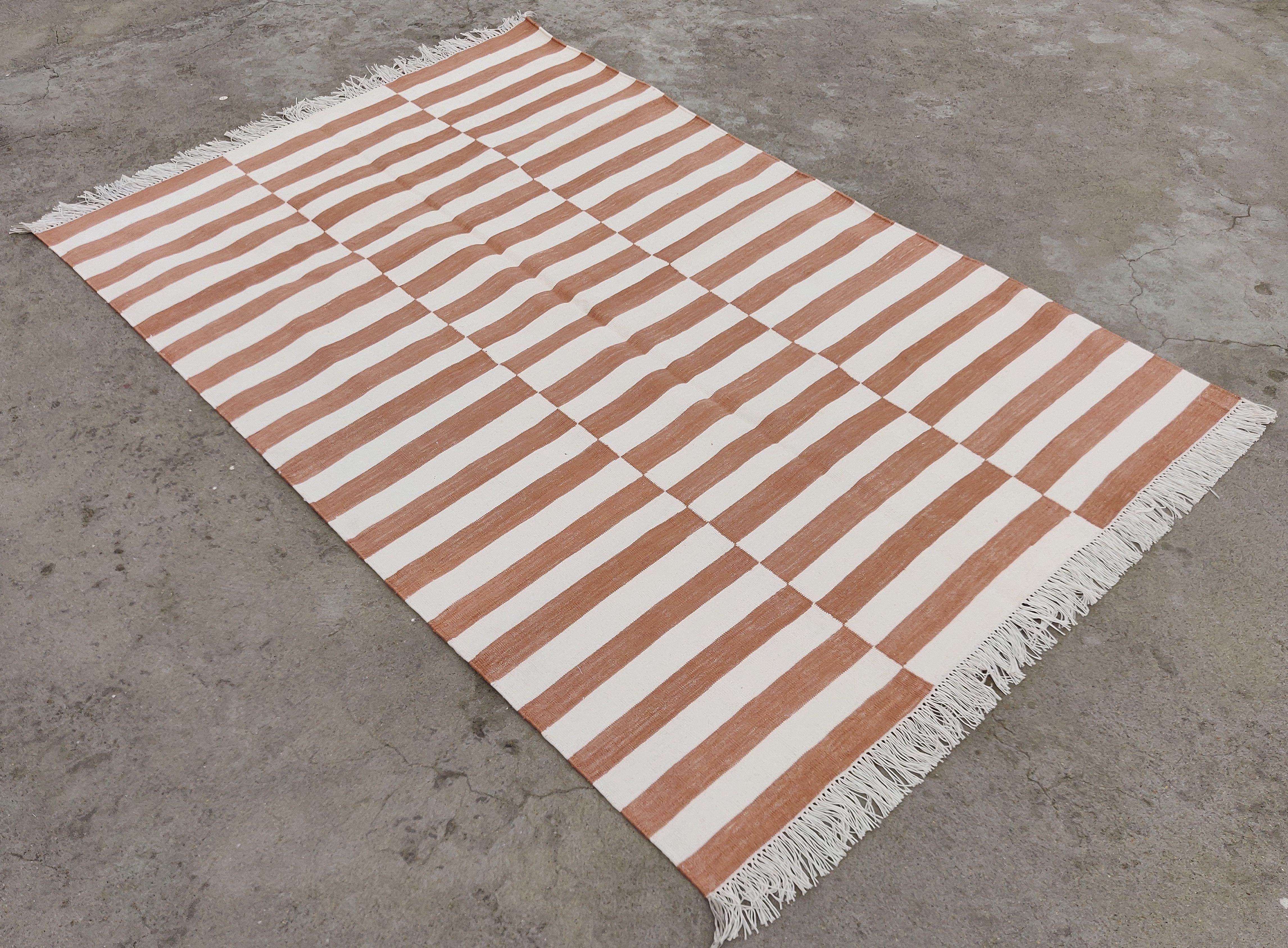 Cotton Vegetable Dyed Tan And White Up Down Striped Indian Rug-4'x6'

These special flat-weave dhurries are hand-woven with 15 ply 100% cotton yarn. Due to the special manufacturing techniques used to create our rugs, the size and color of each