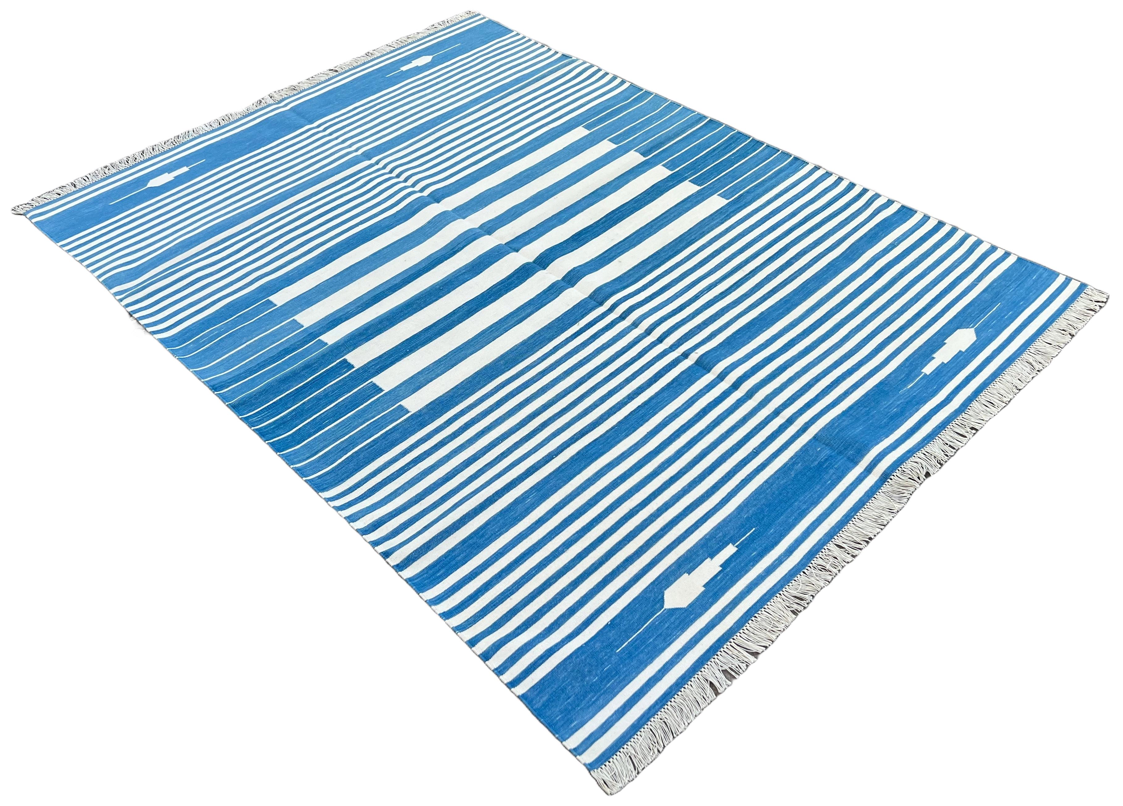 Cotton Vegetable Dyed Sky Blue And White Striped Indian Dhurrie Rug-5'x7'

These special flat-weave dhurries are hand-woven with 15 ply 100% cotton yarn. Due to the special manufacturing techniques used to create our rugs, the size and color of each