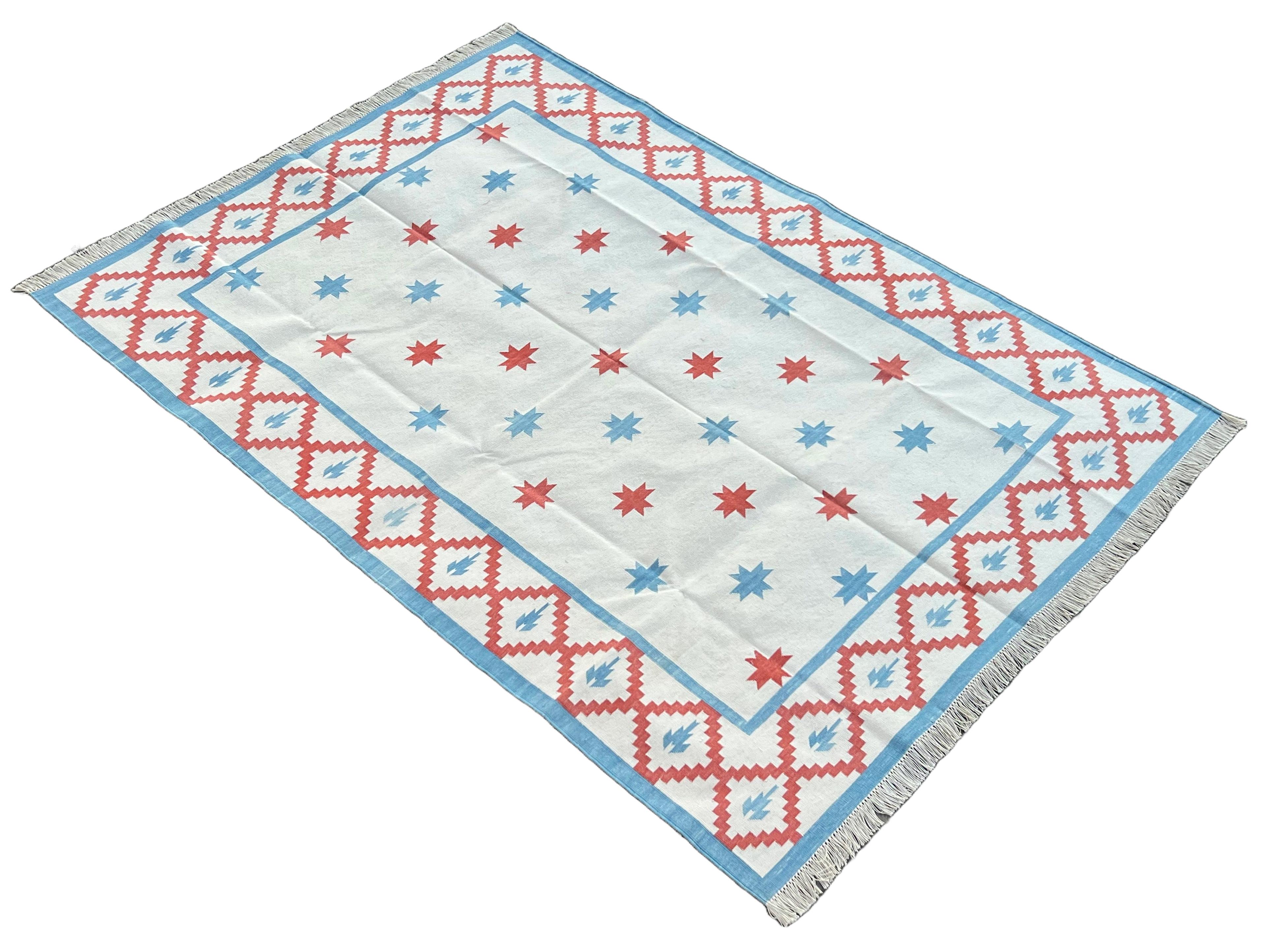 Cotton Vegetable Dyed Cream, Red And Sky Blue Star Indian Dhurrie Rug-5'x7' 
These special flat-weave dhurries are hand-woven with 15 ply 100% cotton yarn. Due to the special manufacturing techniques used to create our rugs, the size and color of