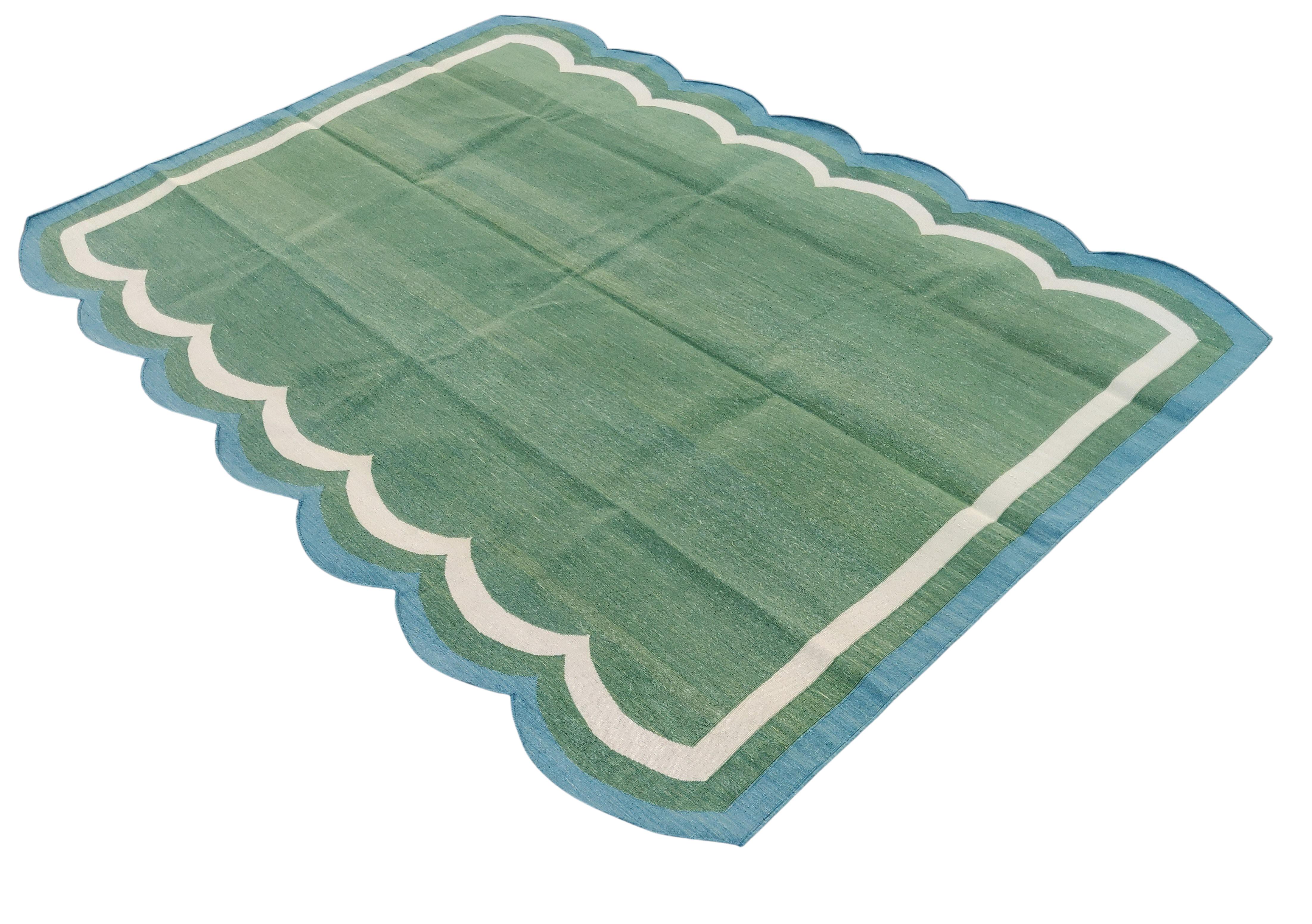 Cotton Natural Vegetable Dyed, Forest Green, Cream And Blue Scalloped Striped Indian Rug - 5'x7'
These special flat-weave dhurries are hand-woven with 15 ply 100% cotton yarn. Due to the special manufacturing techniques used to create our rugs, the