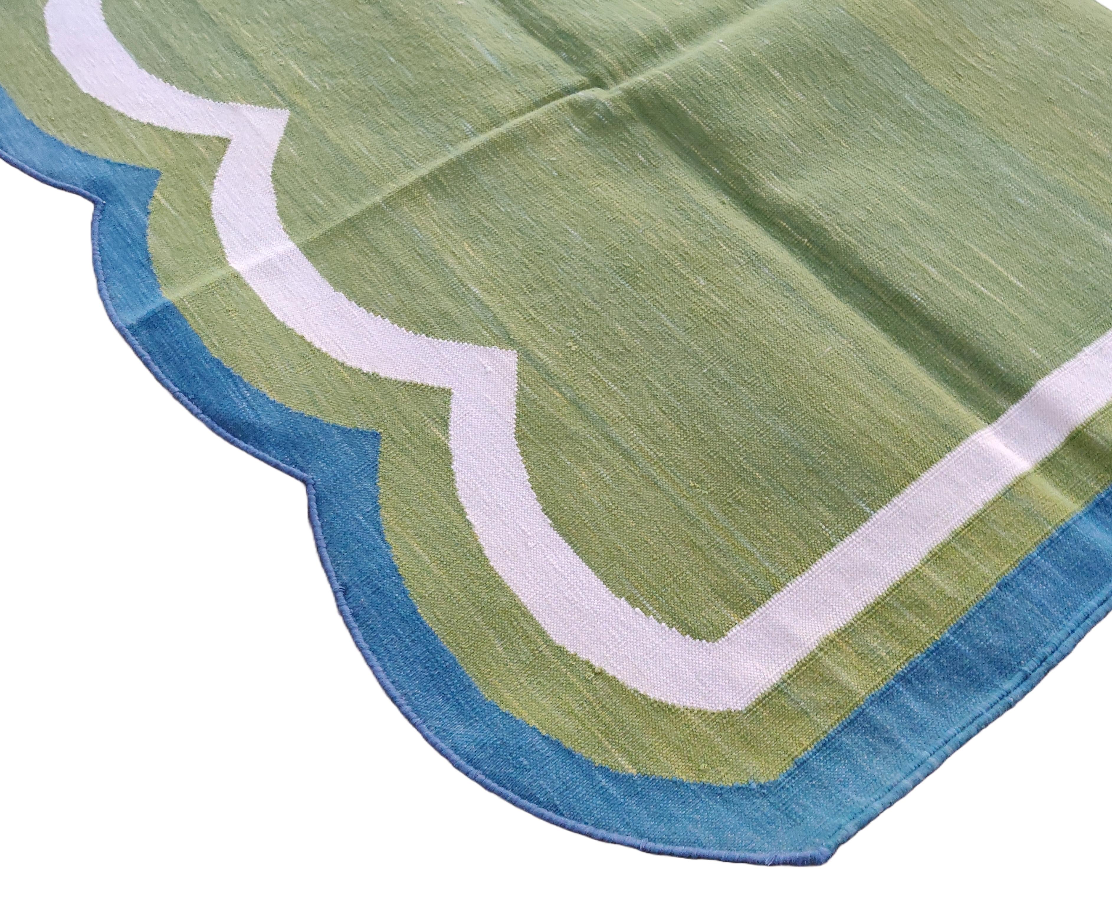 Cotton Vegetable Dyed Moss Green And Blue Scalloped Striped Indian Dhurrie Rug-5'x7' 
These special flat-weave dhurries are hand-woven with 15 ply 100% cotton yarn. Due to the special manufacturing techniques used to create our rugs, the size and