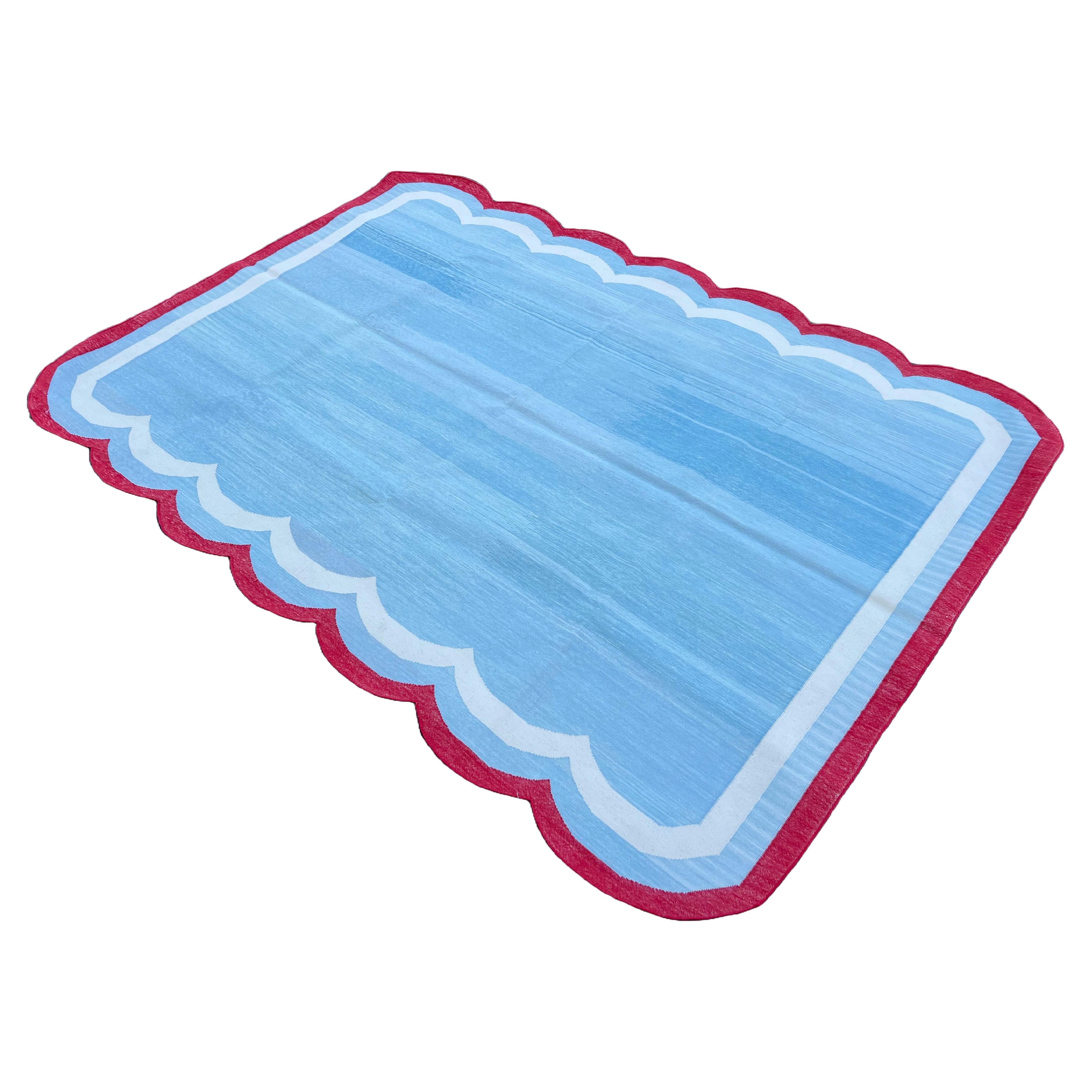 Handmade Cotton Natural Vegetable Dyed, Light Sky Blue, Cream And Red Four Sided Scalloped Indian Dhurrie Rug- Size 5'x7' (150x210cm)
(Scallops on 7' Sides)

These special flat-weave dhurries are hand-woven with 15 ply 100% cotton yarn. Due to the