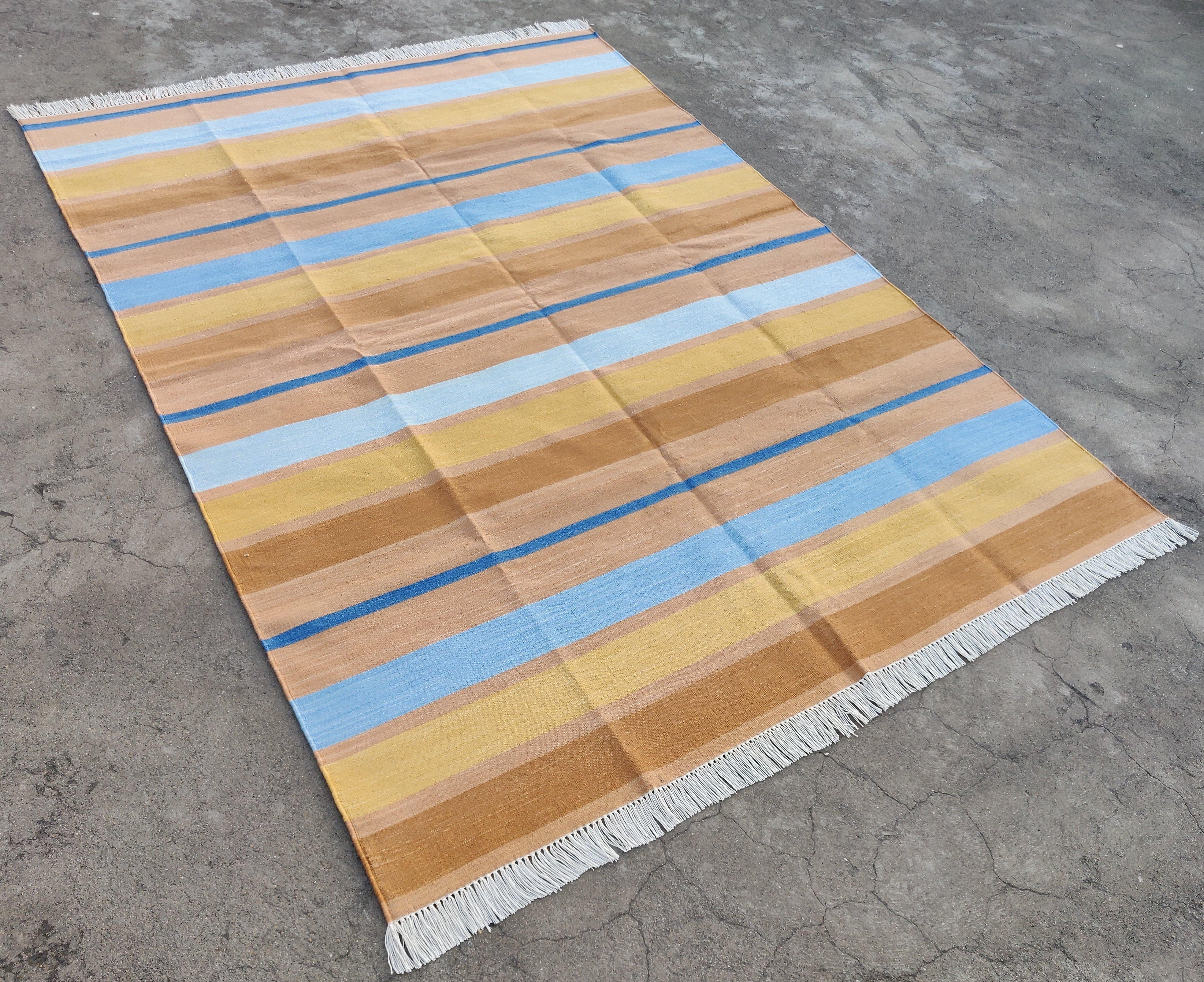 Cotton Vegetable Dyed Tan And Blue Striped Indian Dhurrie Rug-5'x7'

These special flat-weave dhurries are hand-woven with 15 ply 100% cotton yarn. Due to the special manufacturing techniques used to create our rugs, the size and color of each piece