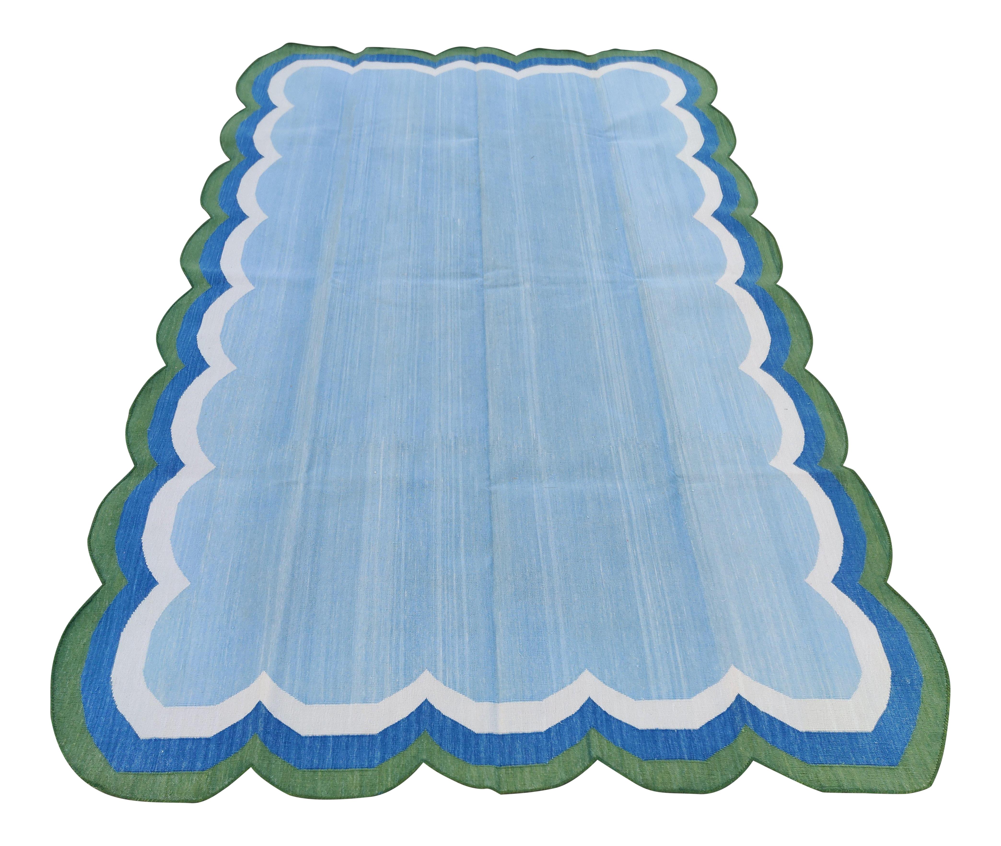 Cotton Vegetable Dyed Blue and Green Four Sided Scalloped Striped Indian Dhurrie Rug-5'x8' 

These special flat-weave dhurries are hand-woven with 15 ply 100% cotton yarn. Due to the special manufacturing techniques used to create our rugs, the size
