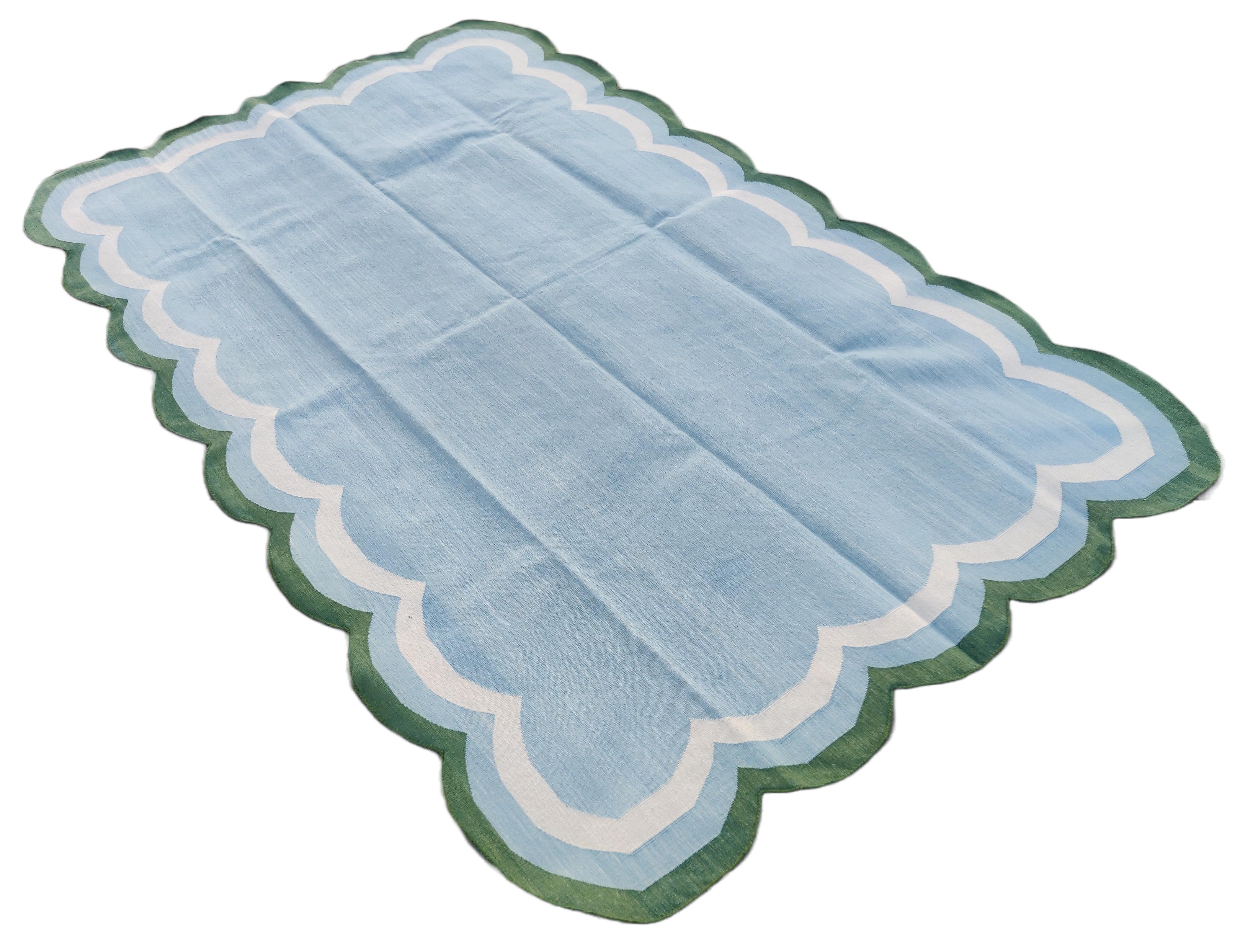 Cotton Vegetable Dyed Sky Blue, Cream And Forest Green Four Sided Scalloped Rug-5'x8' 
(Scallops runs on all Four Sides)
These special flat-weave dhurries are hand-woven with 15 ply 100% cotton yarn. Due to the special manufacturing techniques used