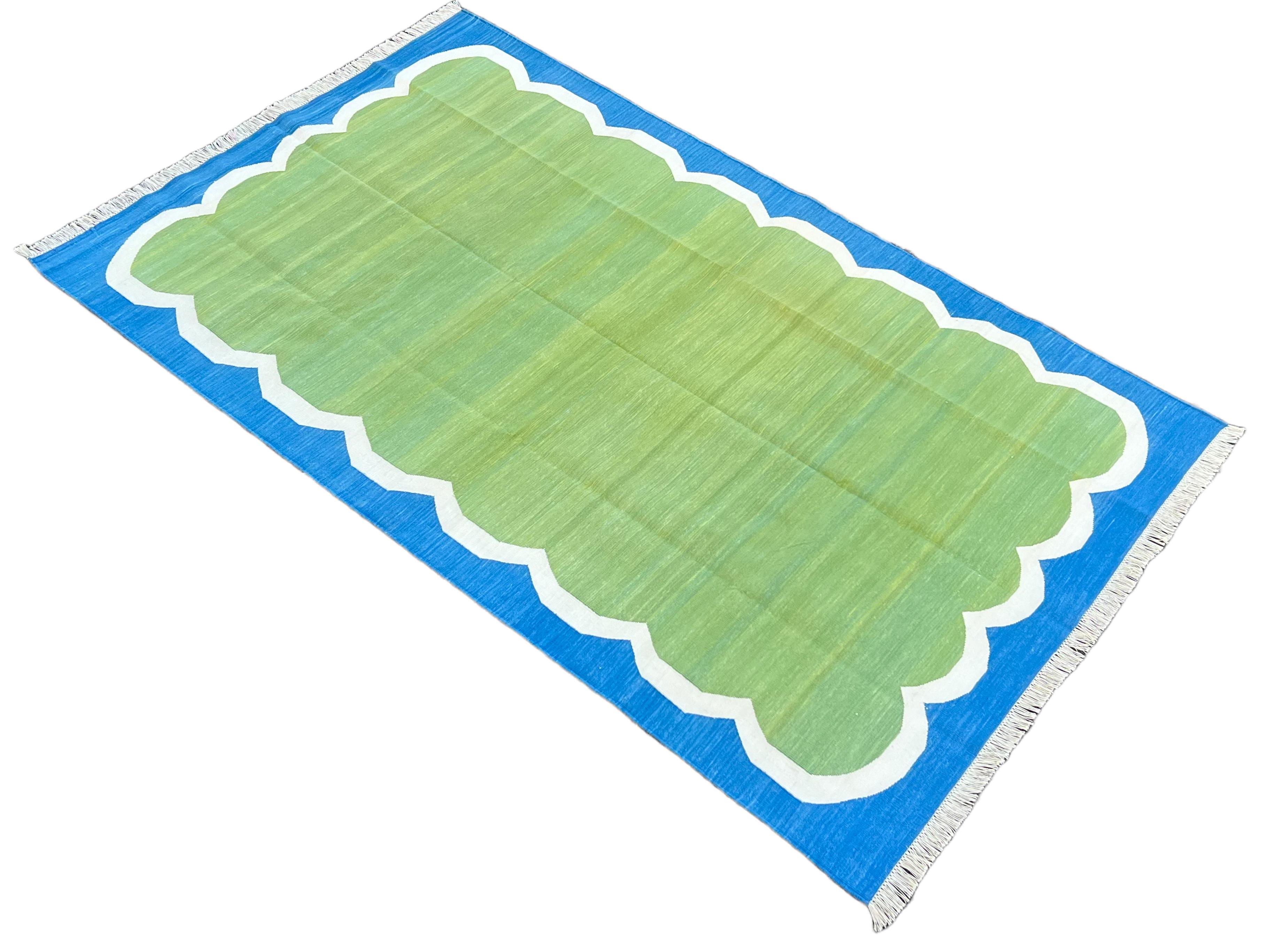 Cotton Vegetable Dyed Green, Cream And Blue Scalloped Striped Indian Dhurrie Rug-5'x8' 
These special flat-weave dhurries are hand-woven with 15 ply 100% cotton yarn. Due to the special manufacturing techniques used to create our rugs, the size and