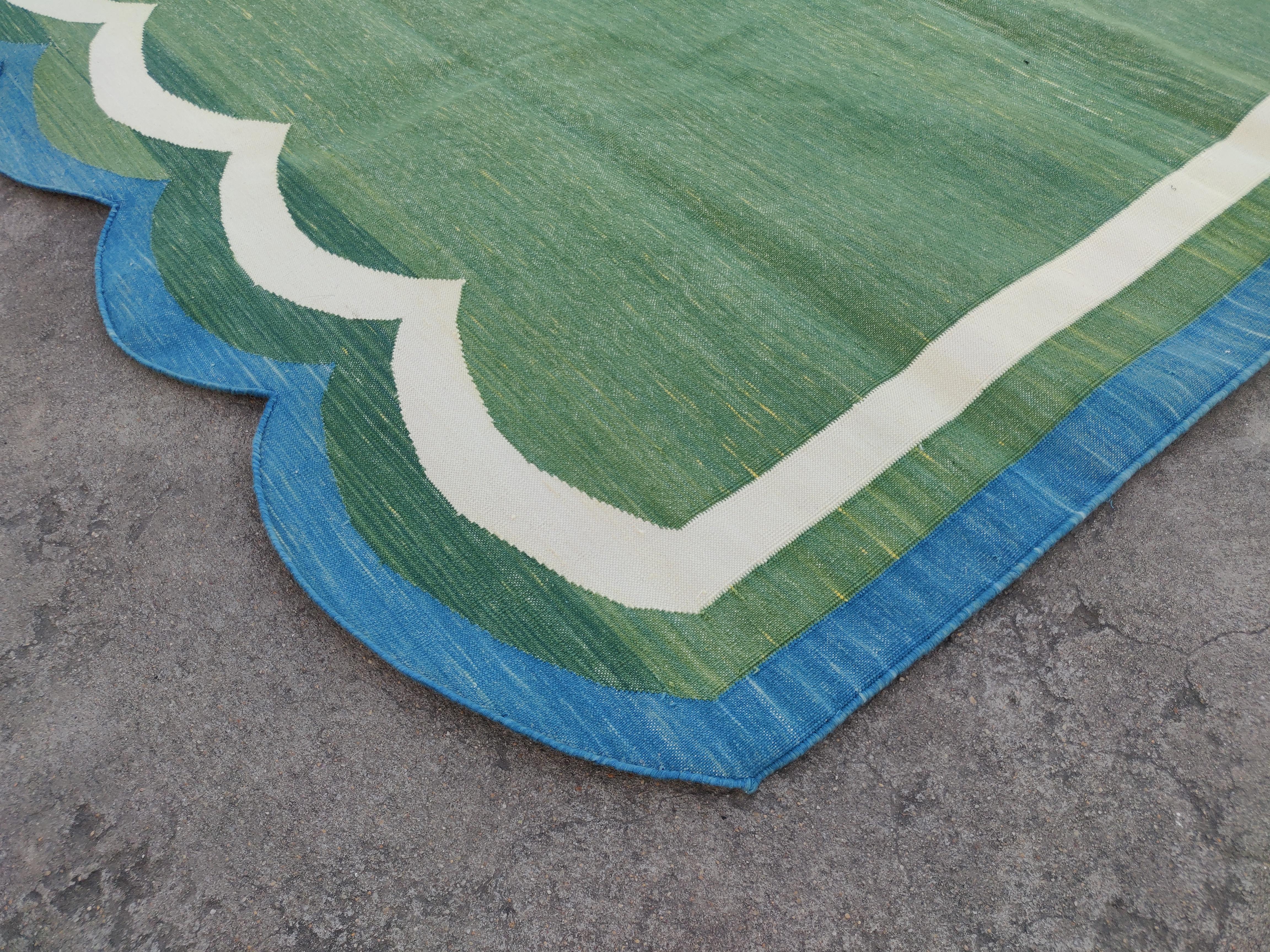 Cotton Natural Vegetable Dyed, Forest Green, Cream And Blue Scalloped Striped Indian Rug - 5'x8' (Scallops runs on 8' sides)
These special flat-weave dhurries are hand-woven with 15 ply 100% cotton yarn. Due to the special manufacturing techniques