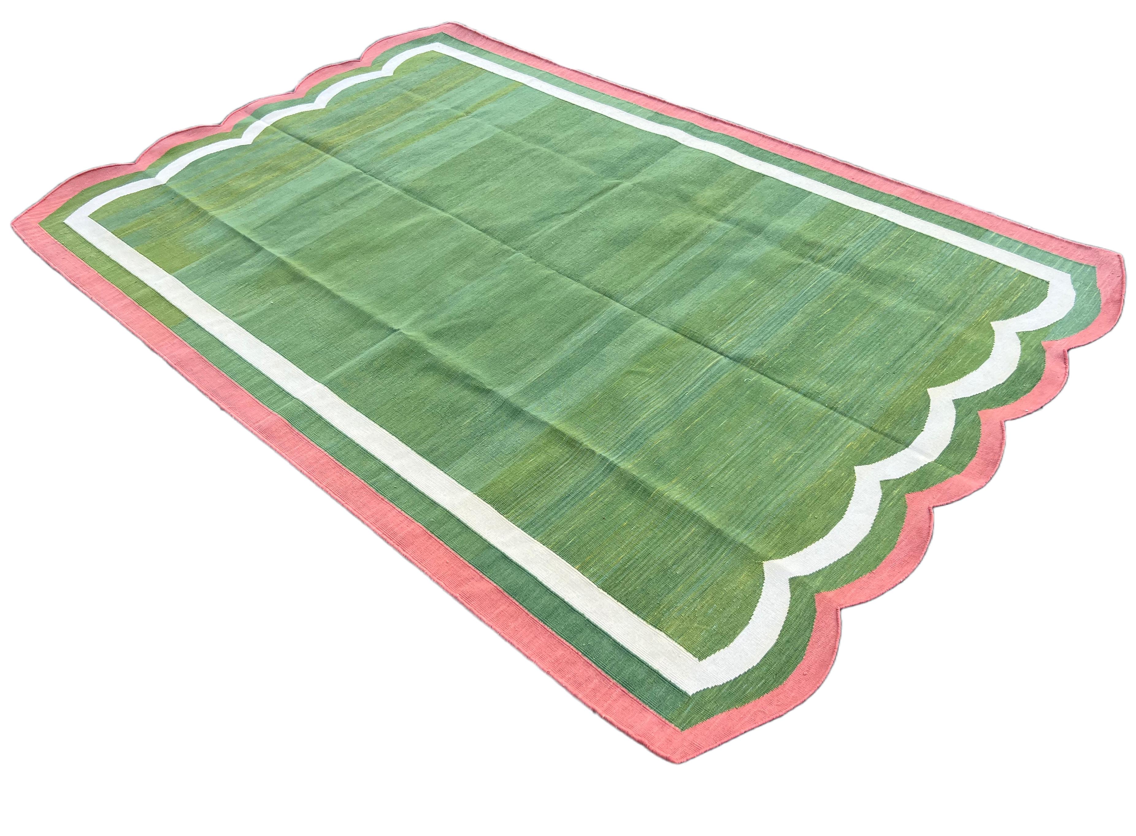 Cotton Vegetable Dyed Forest Green, Cream And Rose Pink Two Sided Scalloped Rug-5'x8' 
(Scallops runs on 5 Feet Sides)
These special flat-weave dhurries are hand-woven with 15 ply 100% cotton yarn. Due to the special manufacturing techniques used to