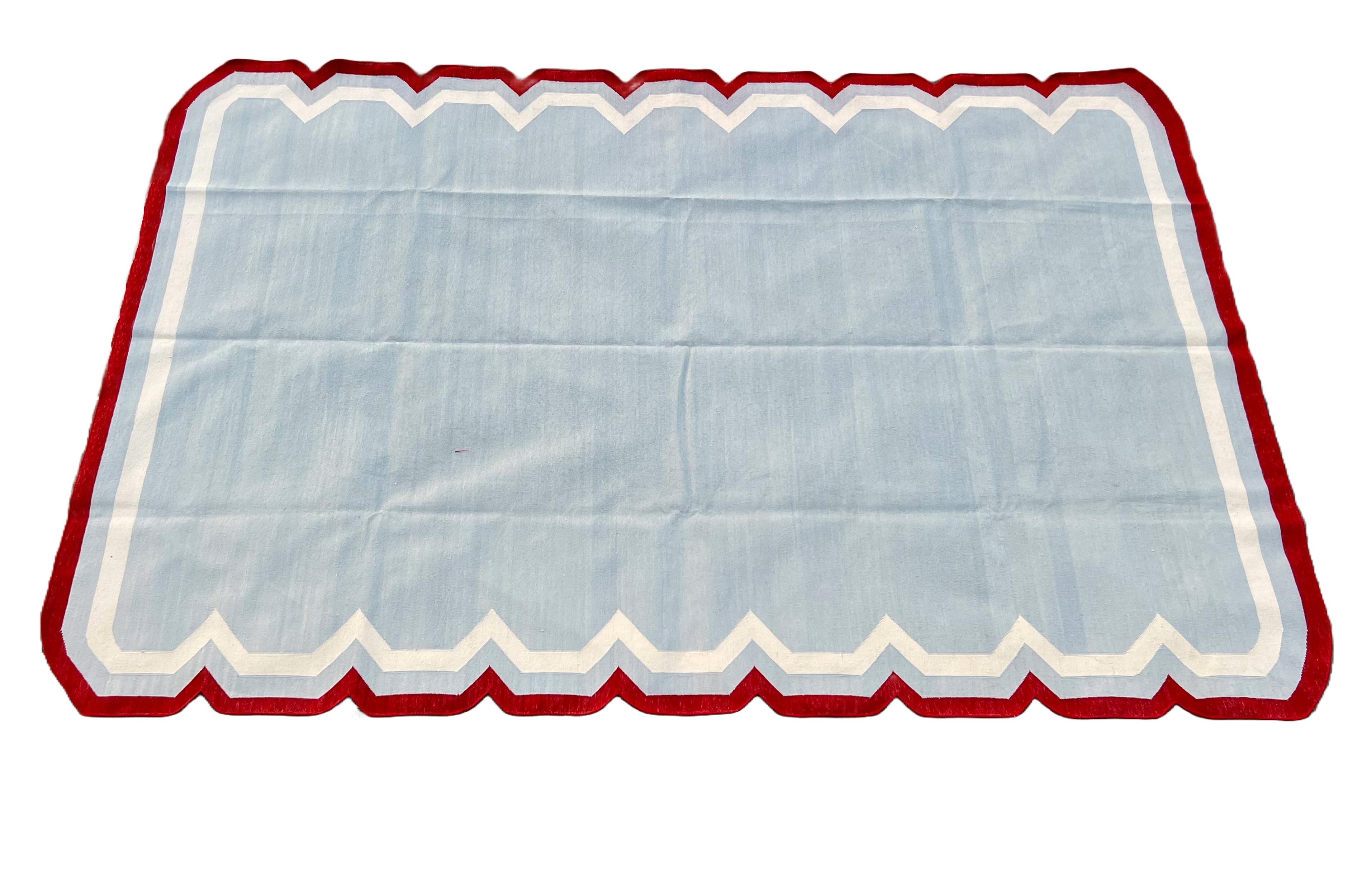 Cotton Vegetable Dyed Sky Blue, Cream And Terracotta Red Scalloped Striped Indian Dhurrie Rug- 5'x8' (150x240cm) 

These special flat-weave dhurries are hand-woven with 15 ply 100% cotton yarn. Due to the special manufacturing techniques used to