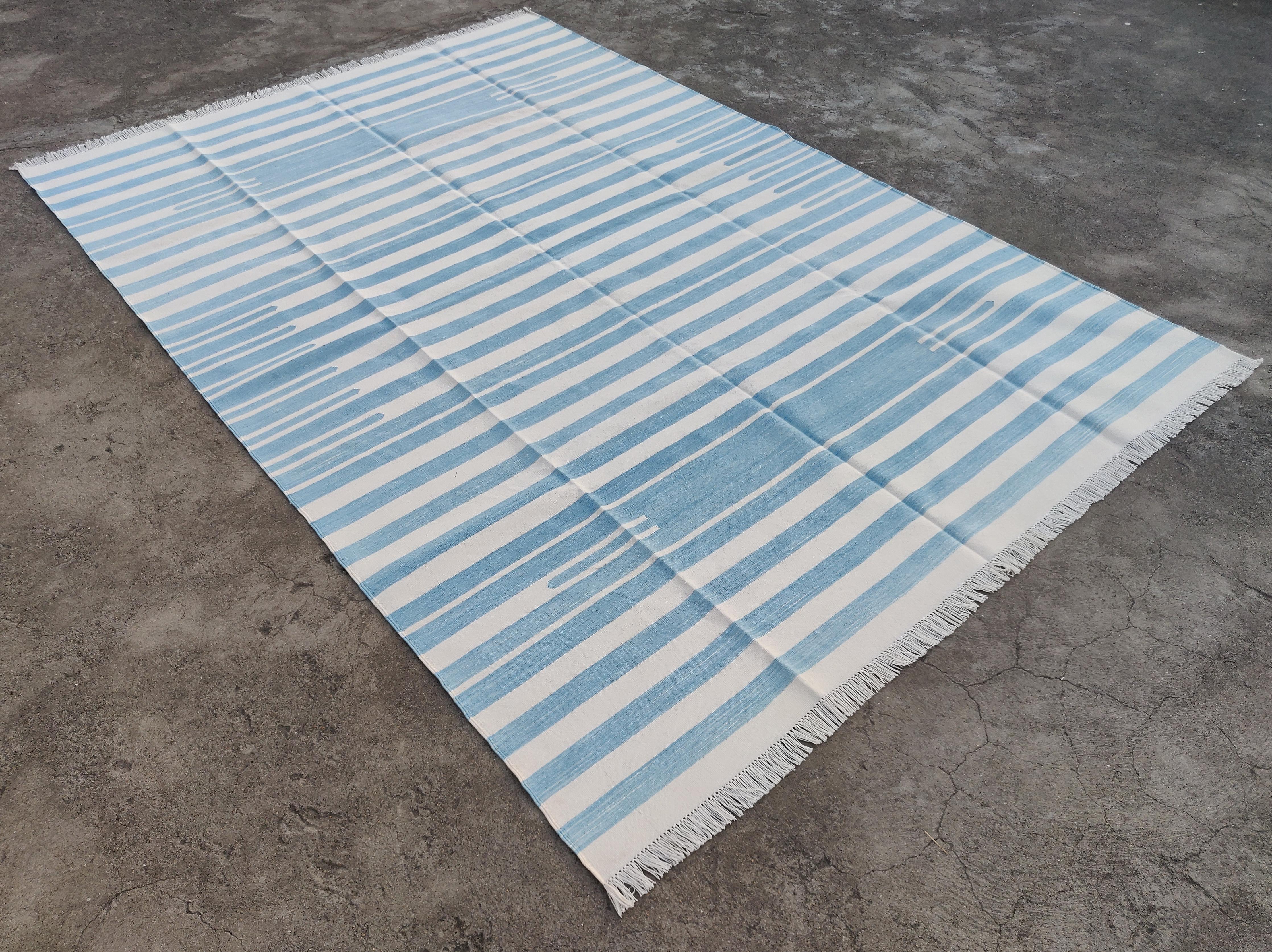 Cotton Vegetable Dyed Reversible Sky Blue And White Striped Indian Dhurrie Rug - 5'x8'
These special flat-weave dhurries are hand-woven with 15 ply 100% cotton yarn. Due to the special manufacturing techniques used to create our rugs, the size and