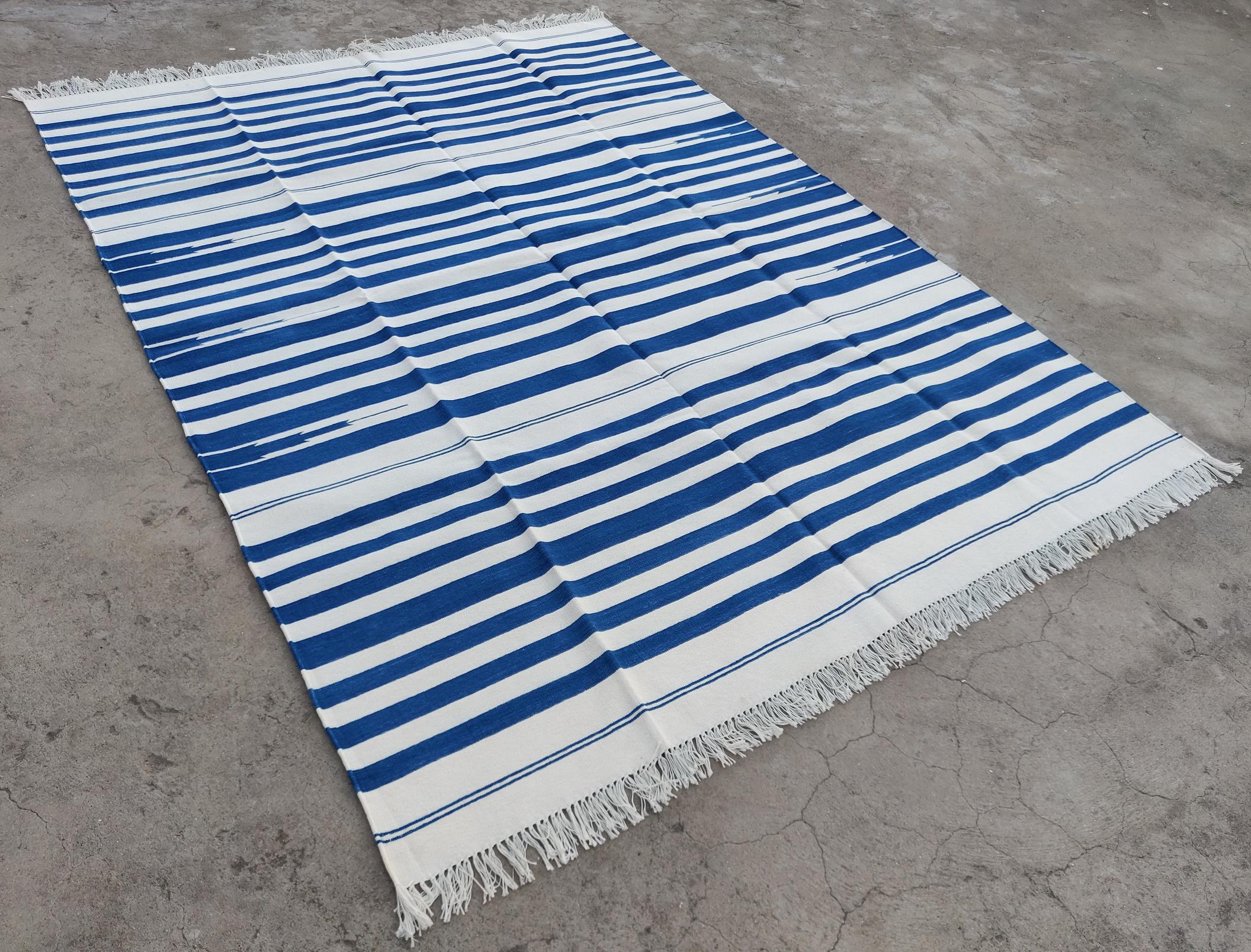 Cotton Vegetable Dyed Blue And White Striped Indian Dhurrie Rug-6'x8' 
These special flat-weave dhurries are hand-woven with 15 ply 100% cotton yarn. Due to the special manufacturing techniques used to create our rugs, the size and color of each