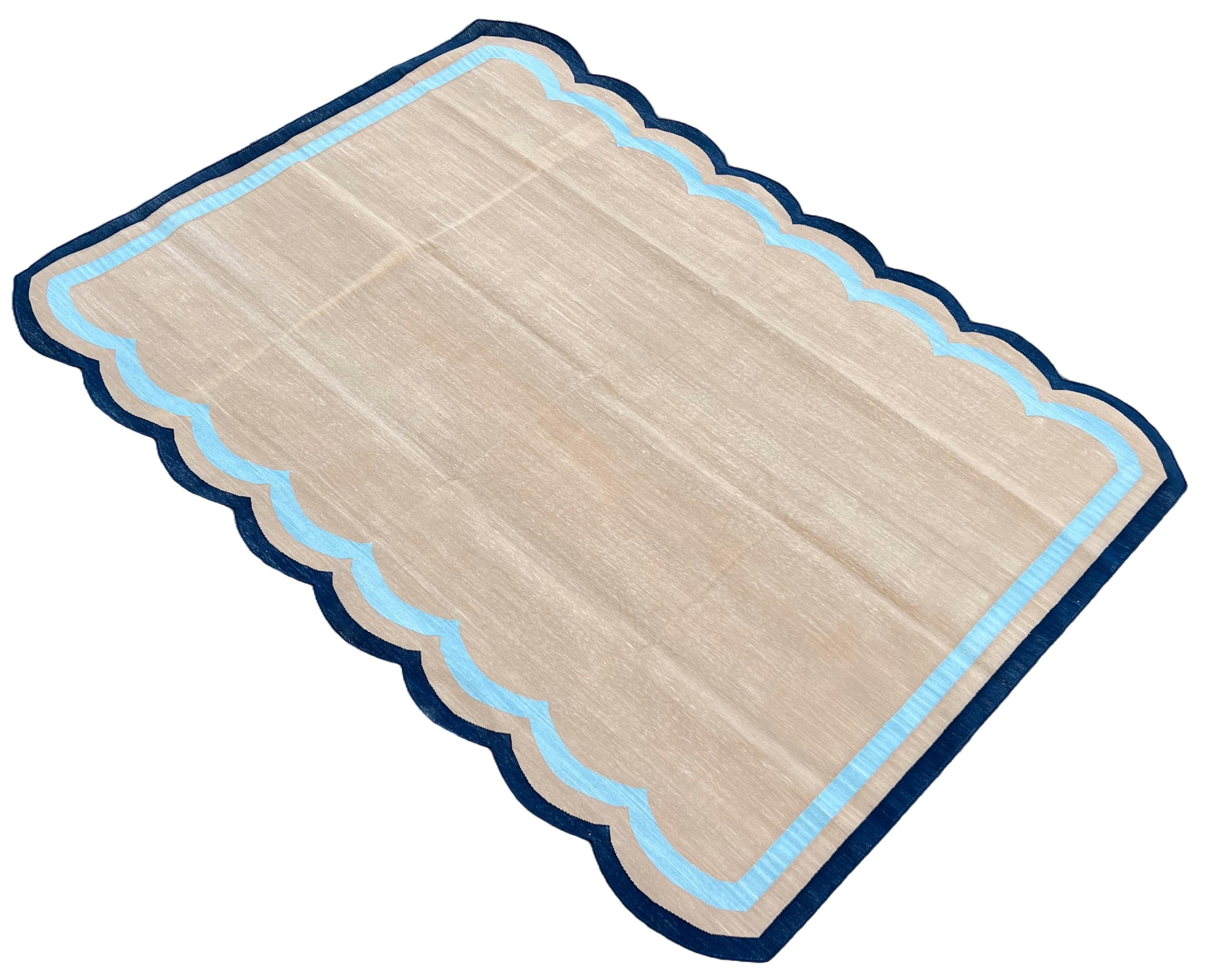 Cotton Vegetable Dyed Muddy Beige, Sky Blue And Navy Blue Two Sided Scalloped Rug-6'x9' (180x270cm)  (Scallops runs on 9 Feet Sides)

These special flat-weave dhurries are hand-woven with 15 ply 100% cotton yarn. Due to the special manufacturing