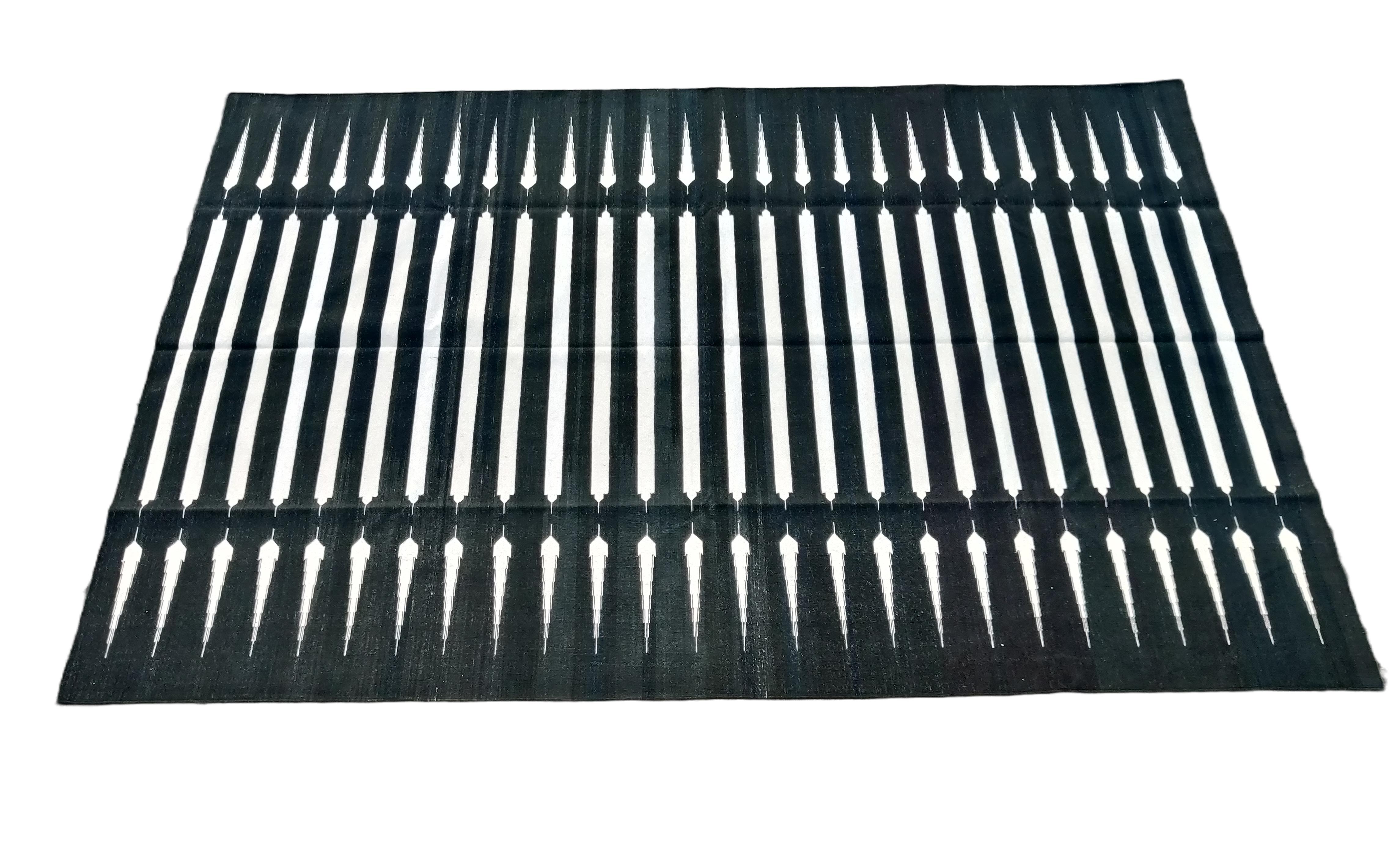 Cotton Vegetable Dyed Black And White Striped Indian Dhurrie Rug-6'x9' (180x270cm) 

These special flat-weave dhurries are hand-woven with 15 ply 100% cotton yarn. Due to the special manufacturing techniques used to create our rugs, the size and
