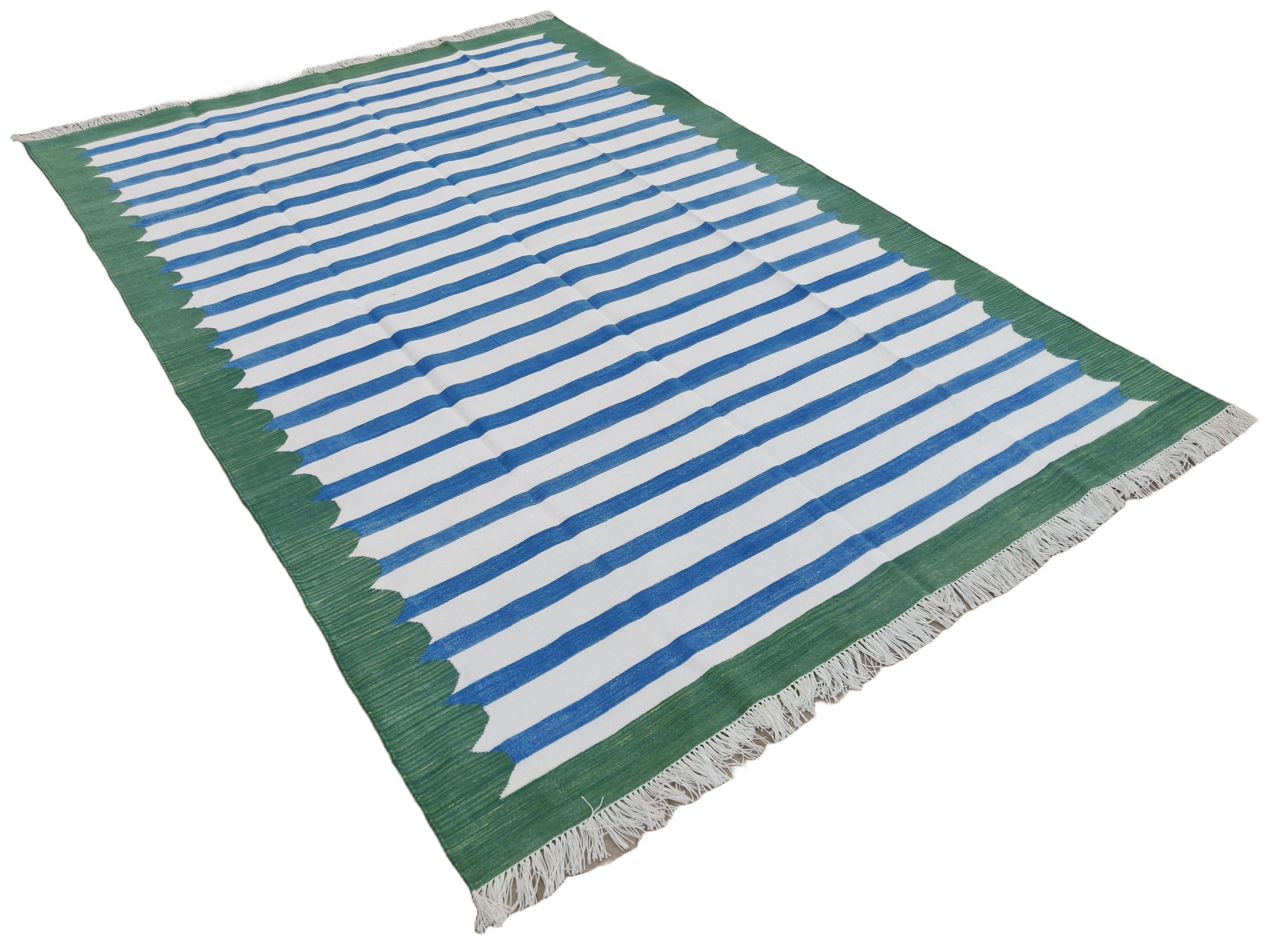 Cotton Vegetable Dyed Blue, White And Forest Green Scalloped Striped Indian Dhurrie Rug-6'x9' 
These special flat-weave dhurries are hand-woven with 15 ply 100% cotton yarn. Due to the special manufacturing techniques used to create our rugs, the