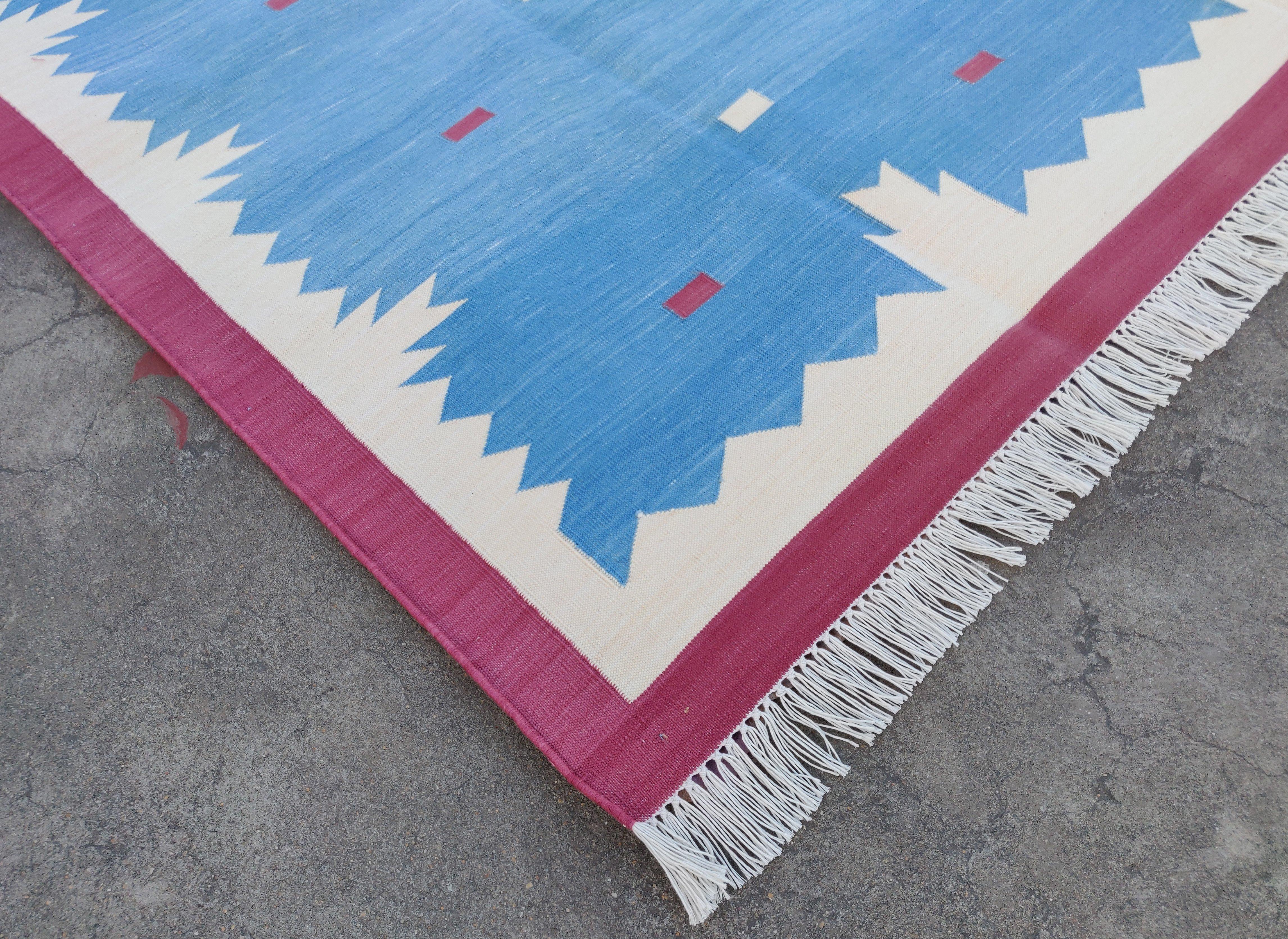 Cotton Vegetable Dyed Sky Blue, Cream And Raspberry Pink Geometric Indian Dhurrie Rug-6'x9' 
These special flat-weave dhurries are hand-woven with 15 ply 100% cotton yarn. Due to the special manufacturing techniques used to create our rugs, the size