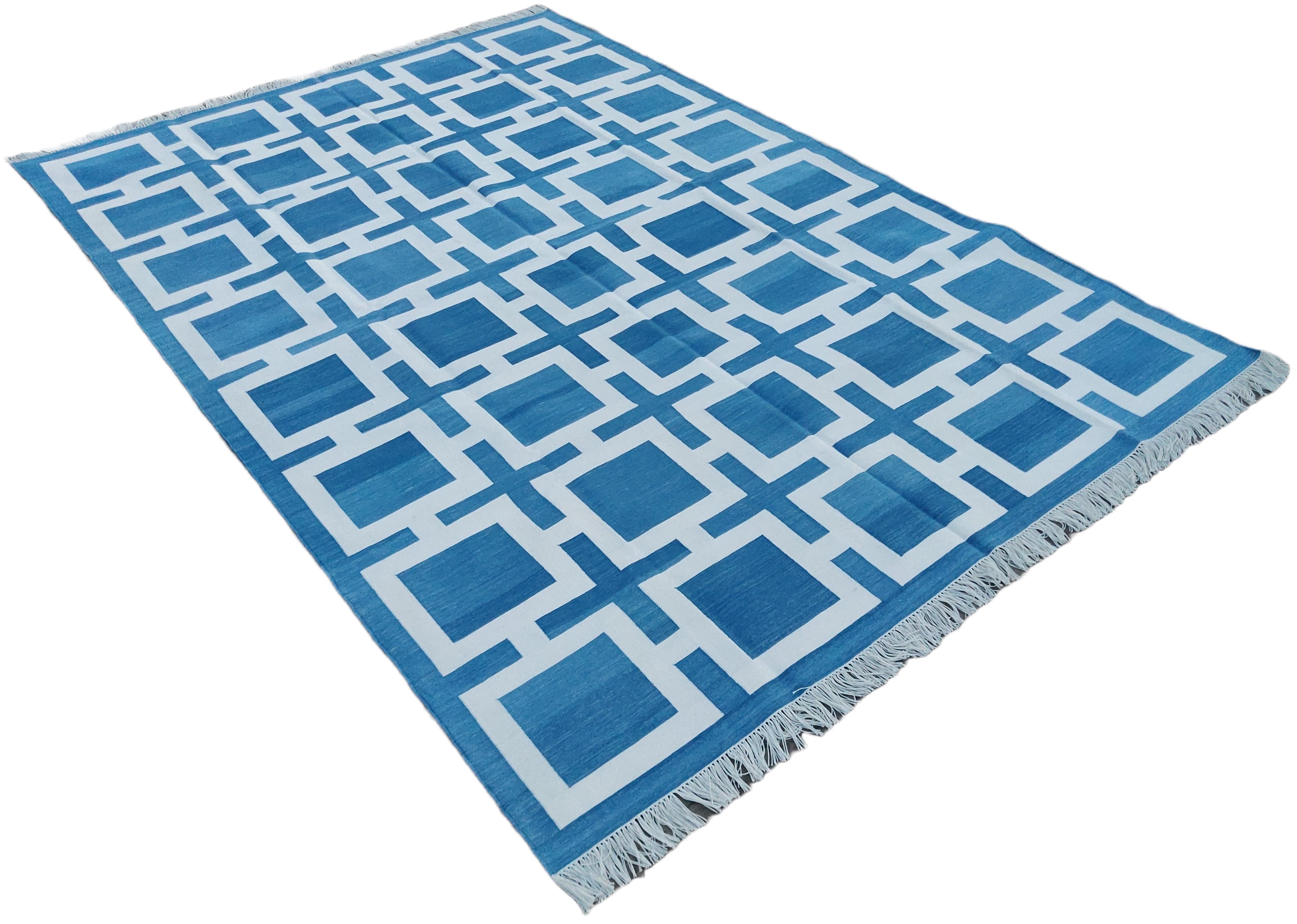 Cotton Vegetable Dyed Sky Blue And White Geometric Indian Rug-6'x9' 
These special flat-weave dhurries are hand-woven with 15 ply 100% cotton yarn. Due to the special manufacturing techniques used to create our rugs, the size and color of each piece