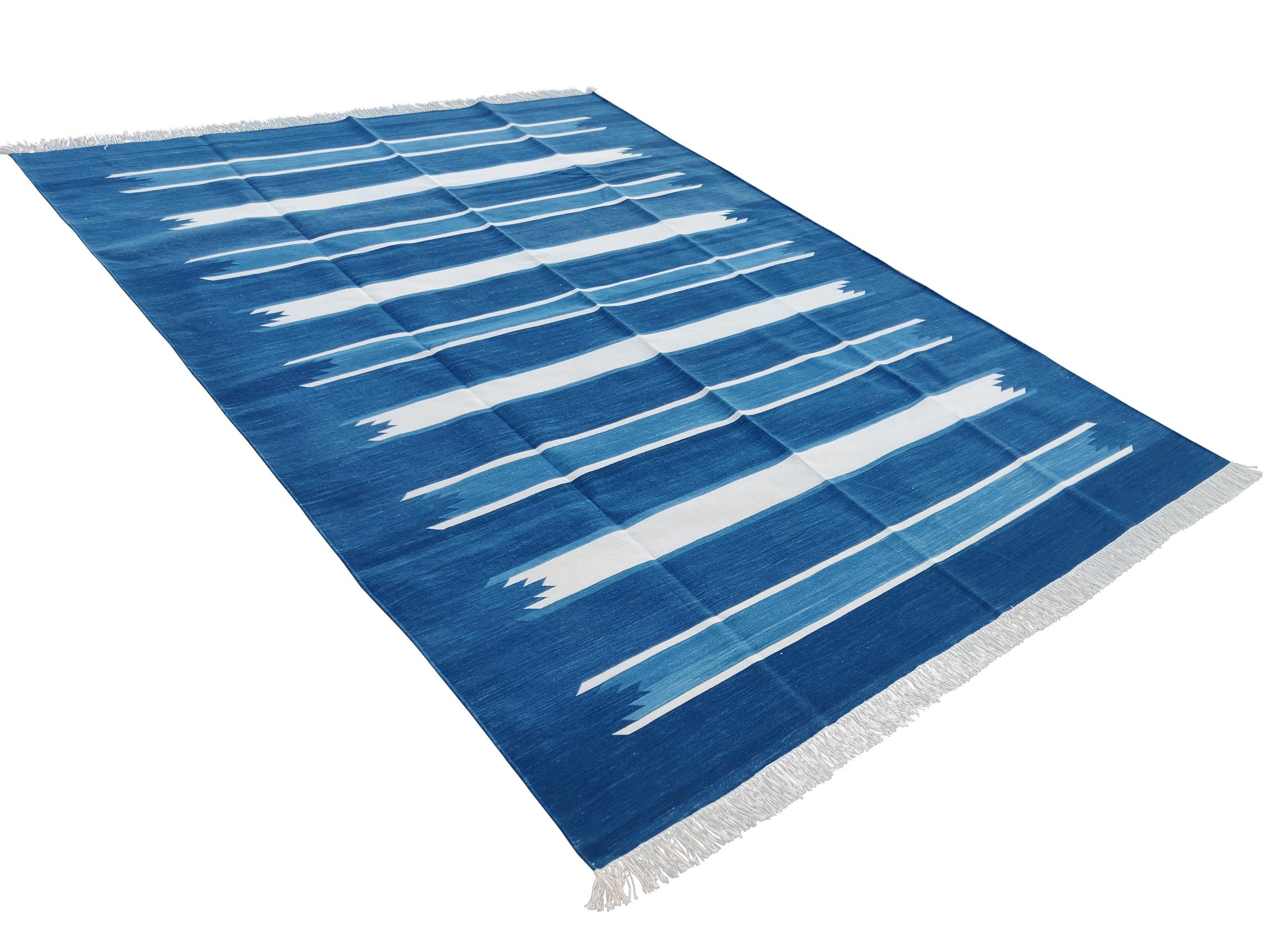 Cotton Vegetable Dyed Blue And White Striped Indian Dhurrie Rug-6'x9' 
These special flat-weave dhurries are hand-woven with 15 ply 100% cotton yarn. Due to the special manufacturing techniques used to create our rugs, the size and color of each
