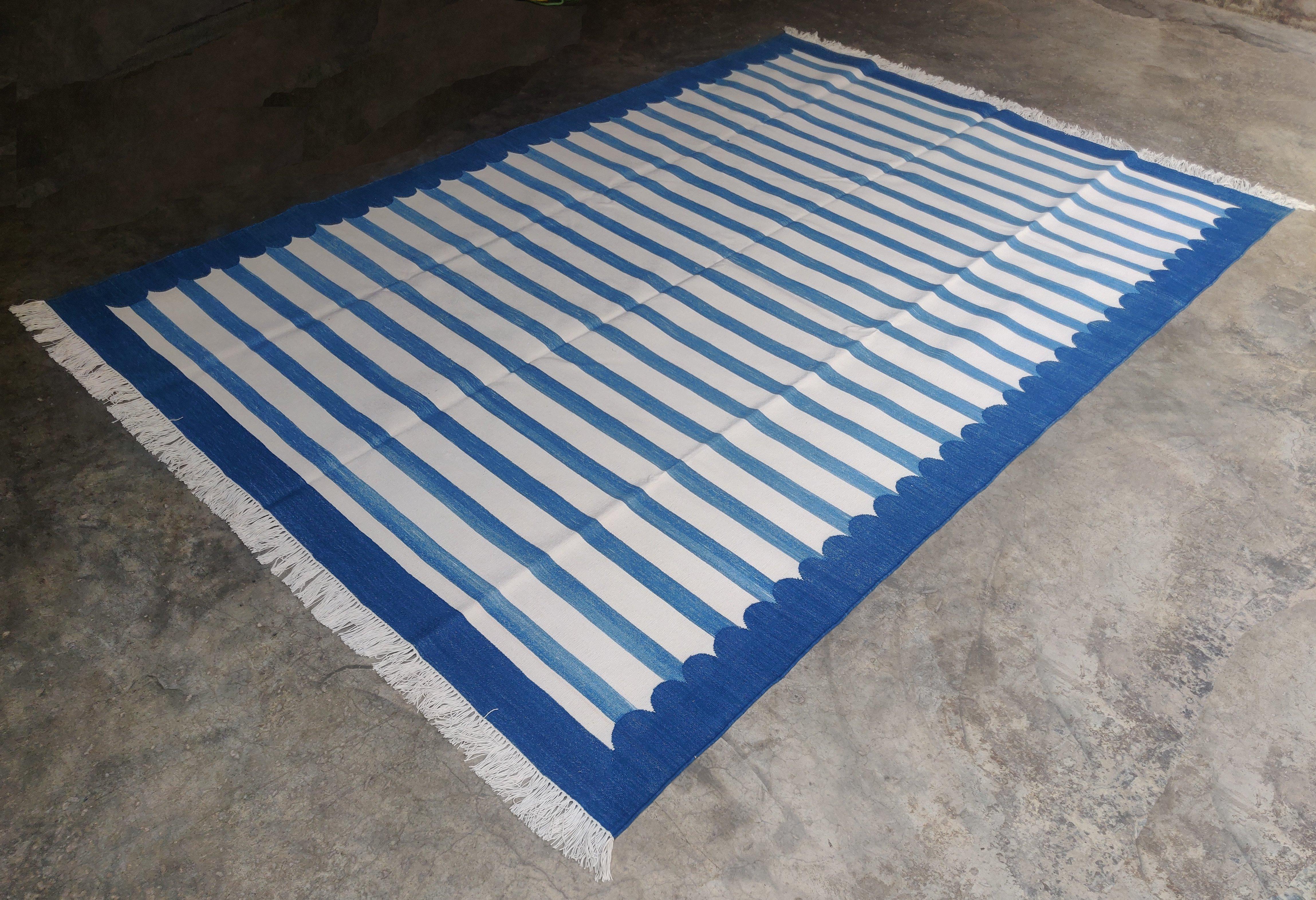 Cotton Vegetable Dyed Indigo Blue and White Striped Scalloped Indian Dhurrie Rug-6'x9' 

These special flat-weave dhurries are hand-woven with 15 ply 100% cotton yarn. Due to the special manufacturing techniques used to create our rugs, the size and