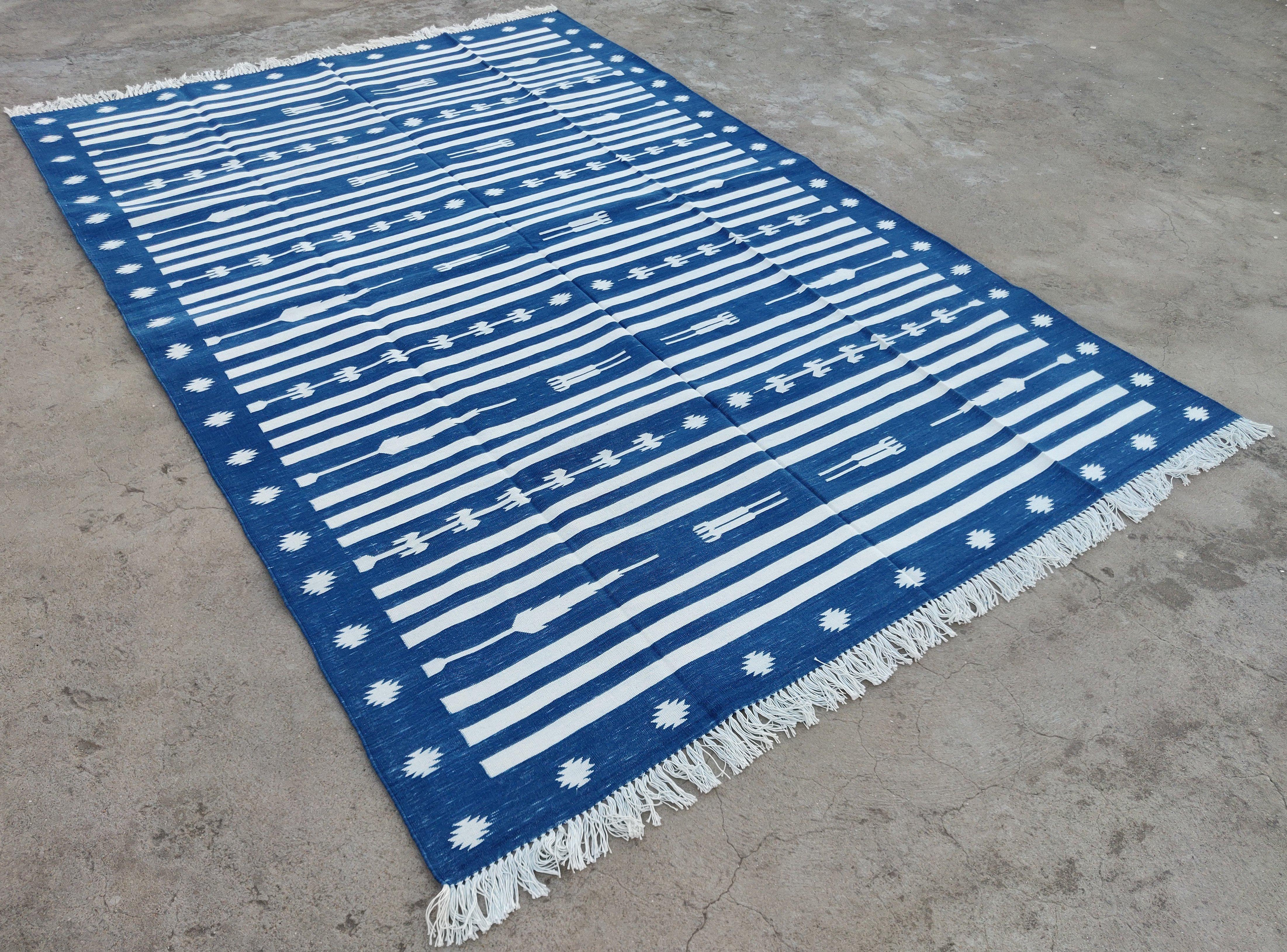 Cotton Vegetable Dyed Indigo Blue and White Striped Indian Dhurrie Rug-6'x9' 

These special flat-weave dhurries are hand-woven with 15 ply 100% cotton yarn. Due to the special manufacturing techniques used to create our rugs, the size and color of