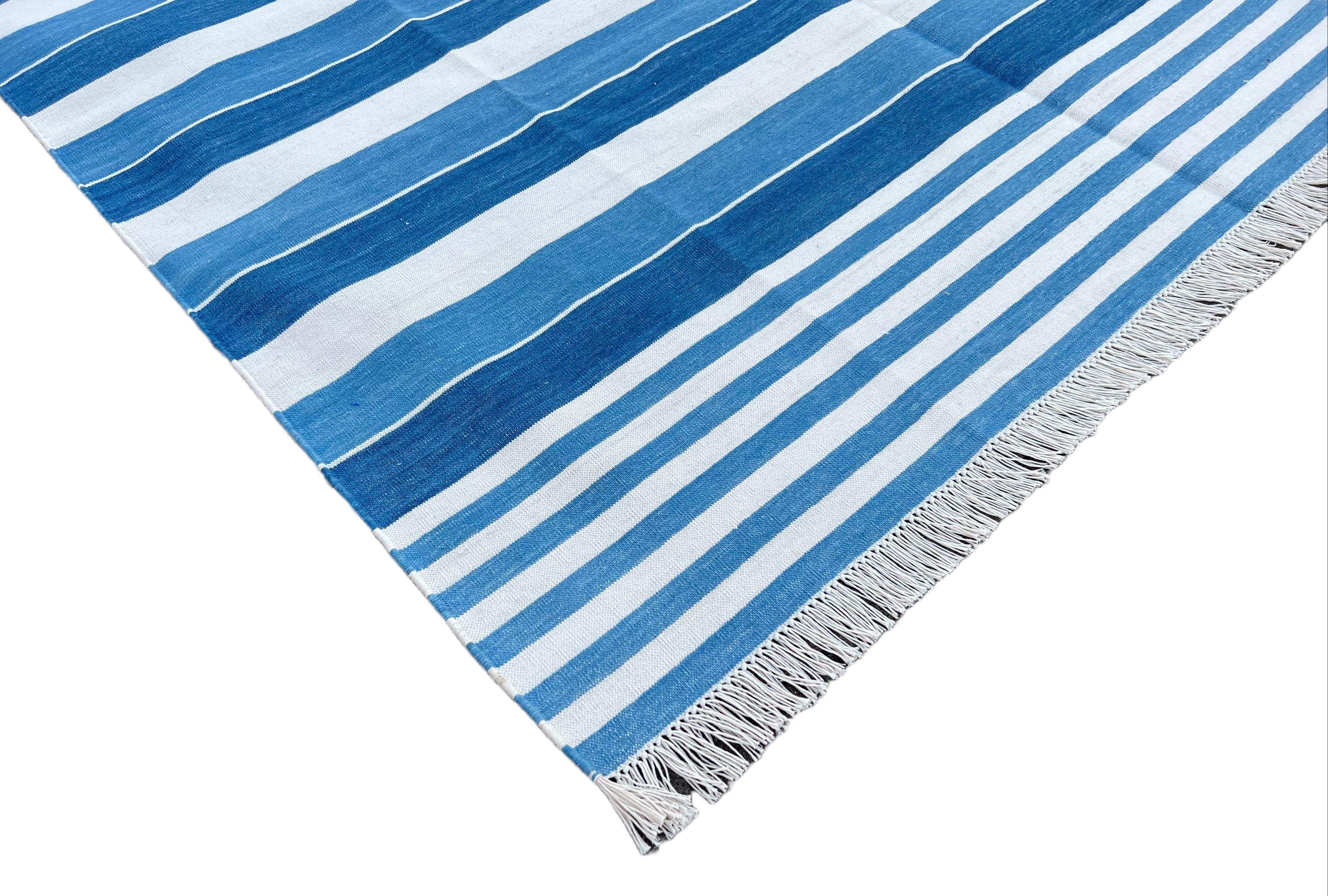 Cotton Vegetable Dyed Blue And White Striped Indian Dhurrie Rug - 6'x9' (180x270cm) 

These special flat-weave dhurries are hand-woven with 15 ply 100% cotton yarn. Due to the special manufacturing techniques used to create our rugs, the size and