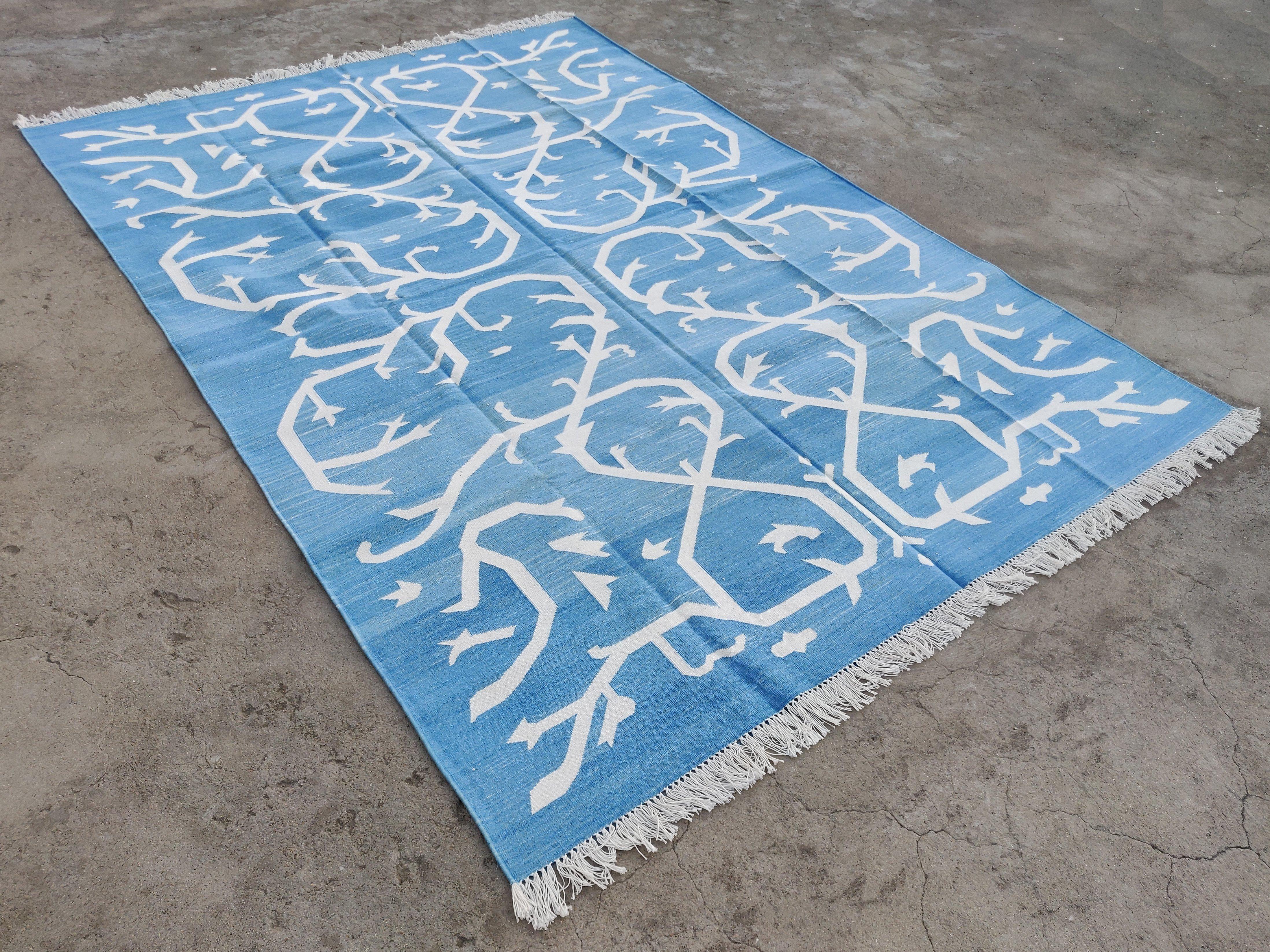 Cotton Vegetable Dyed Sky Blue And White Tree Pattern Indian Dhurrie Rug-6'x9' 
These special flat-weave dhurries are hand-woven with 15 ply 100% cotton yarn. Due to the special manufacturing techniques used to create our rugs, the size and color of