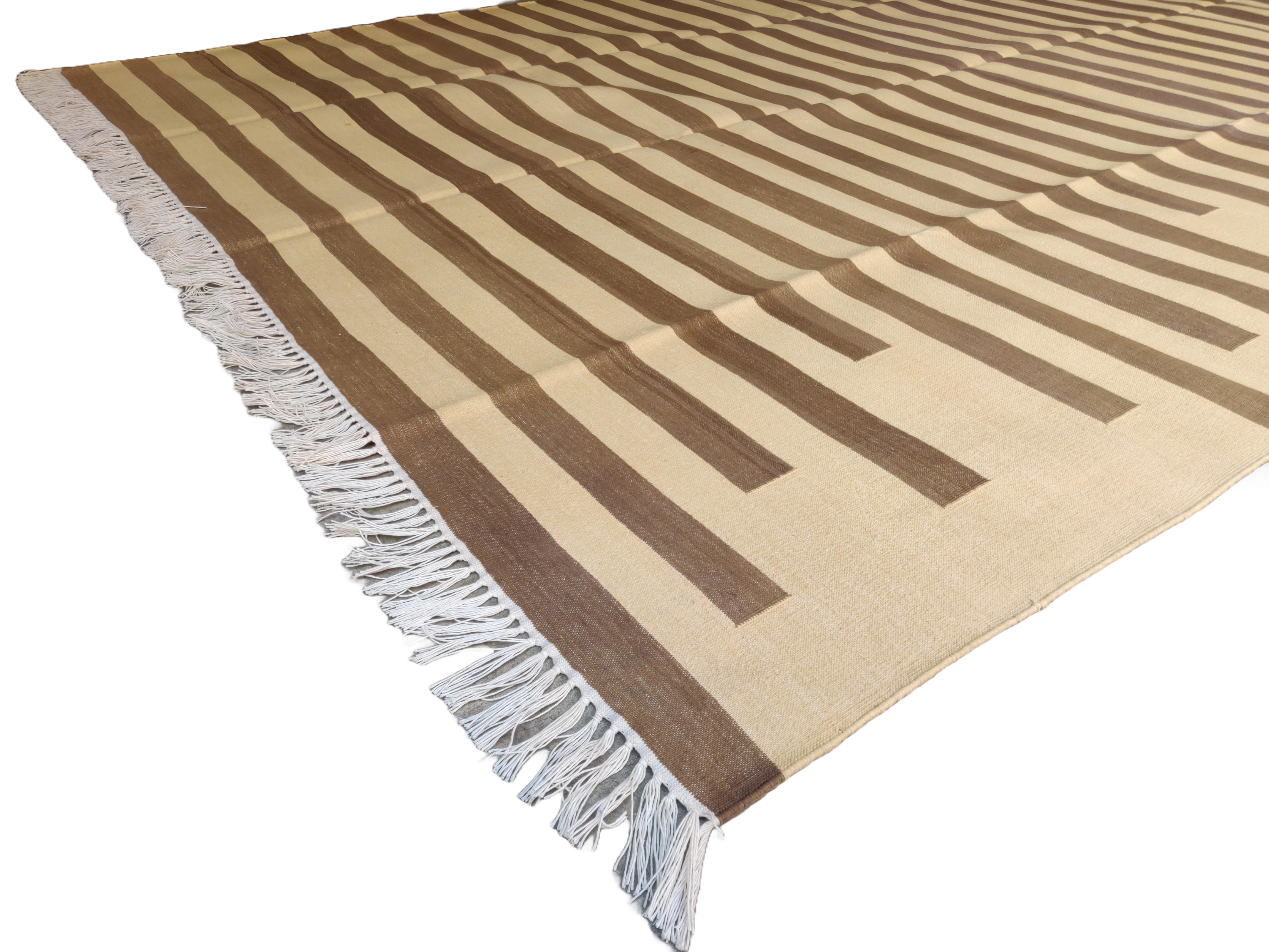 Cotton Vegetable Dyed Brown And Yellow Striped Indian Dhurrie Rug-6'x9' (180x270cm) 

These special flat-weave dhurries are hand-woven with 15 ply 100% cotton yarn. Due to the special manufacturing techniques used to create our rugs, the size and