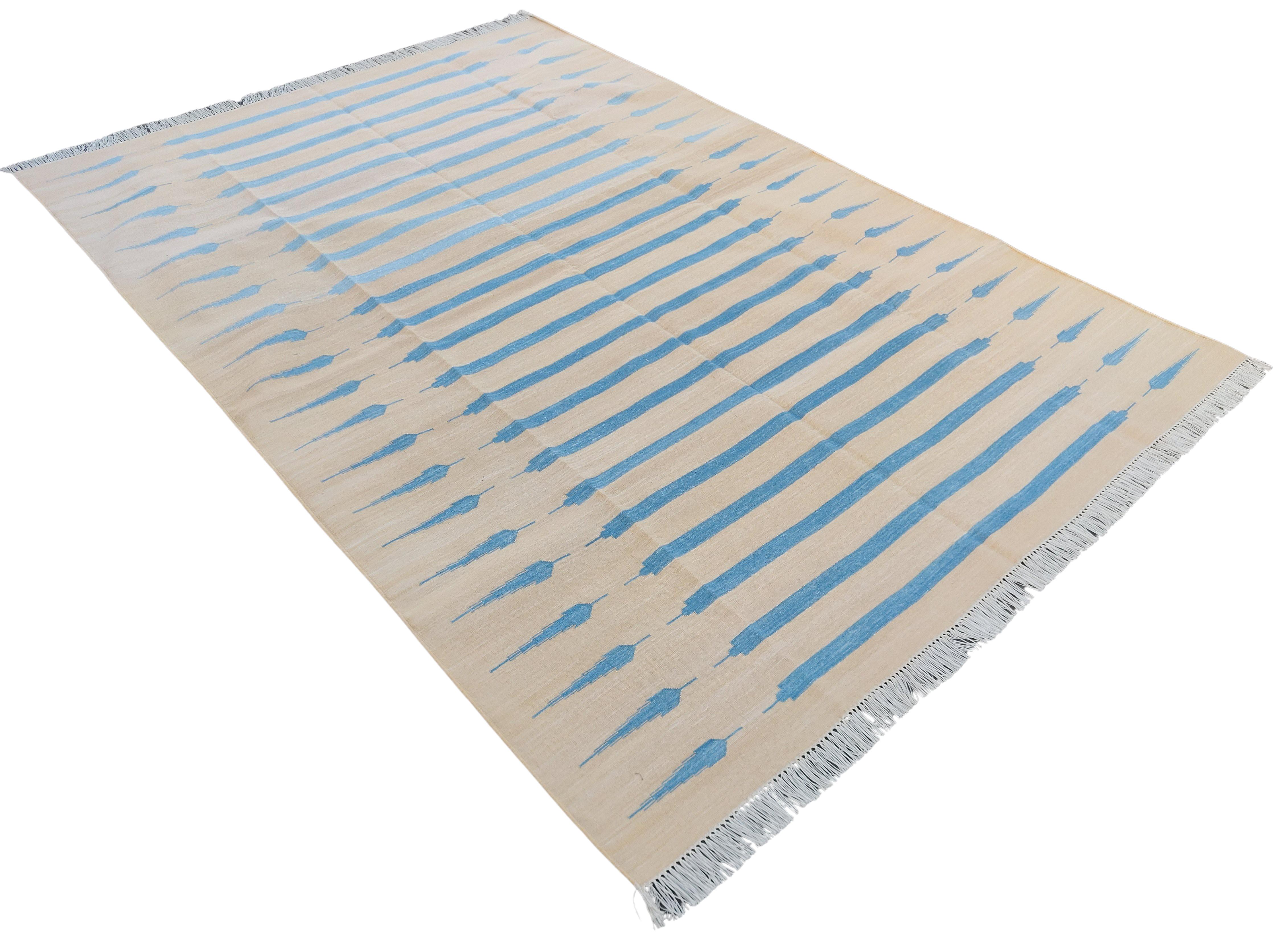 Cotton Vegetable Dyed Cream And Sky Blue Striped Indian Dhurrie Rug-6'x9' 
These special flat-weave dhurries are hand-woven with 15 ply 100% cotton yarn. Due to the special manufacturing techniques used to create our rugs, the size and color of each