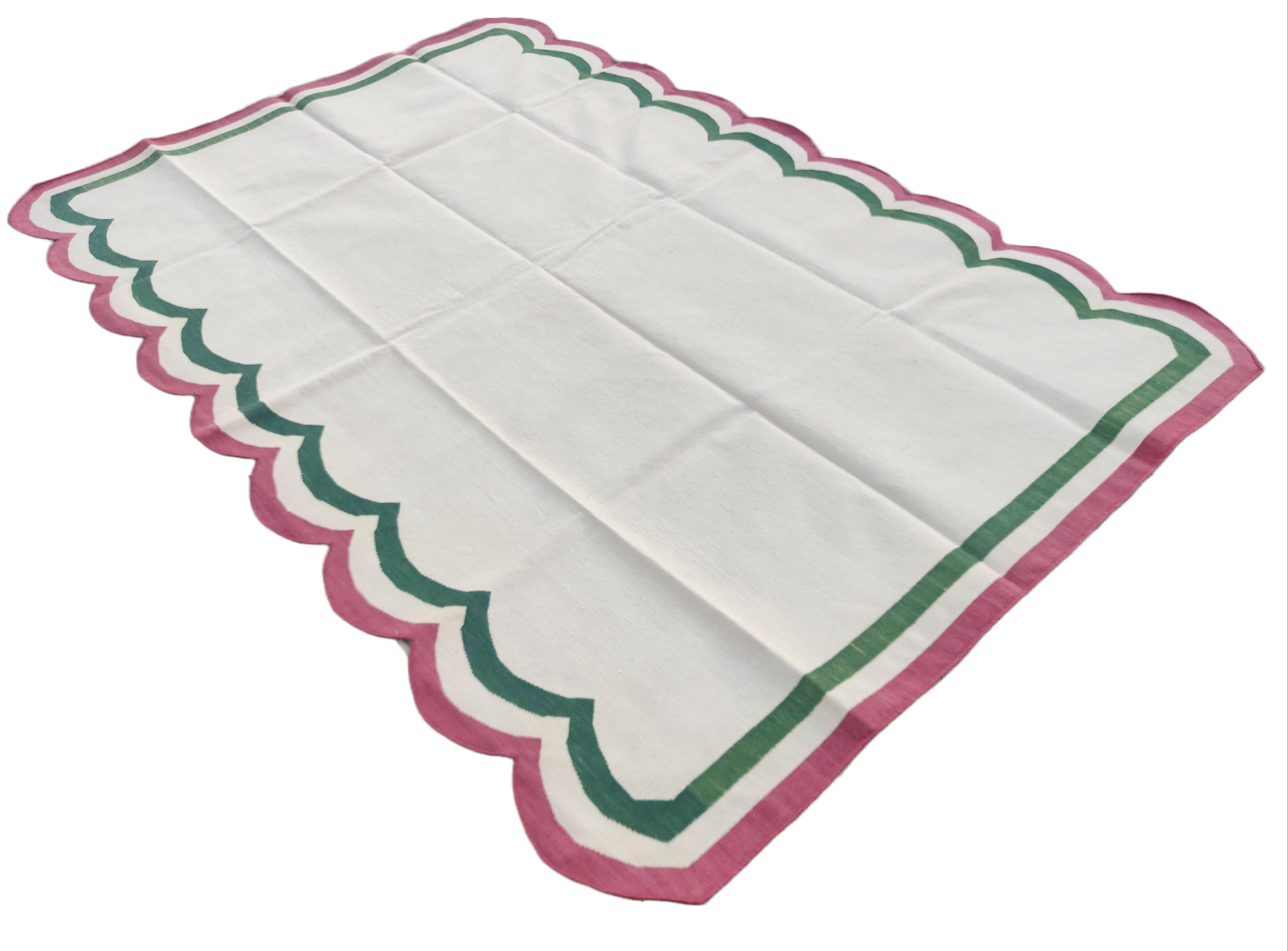 Cotton Vegetable Dyed Cream, Forest Green And Raspberry Pink Two Sided Scalloped Rug-6'x9' 
(Scallops runs on 9 Feet Sides)
These special flat-weave dhurries are hand-woven with 15 ply 100% cotton yarn. Due to the special manufacturing techniques