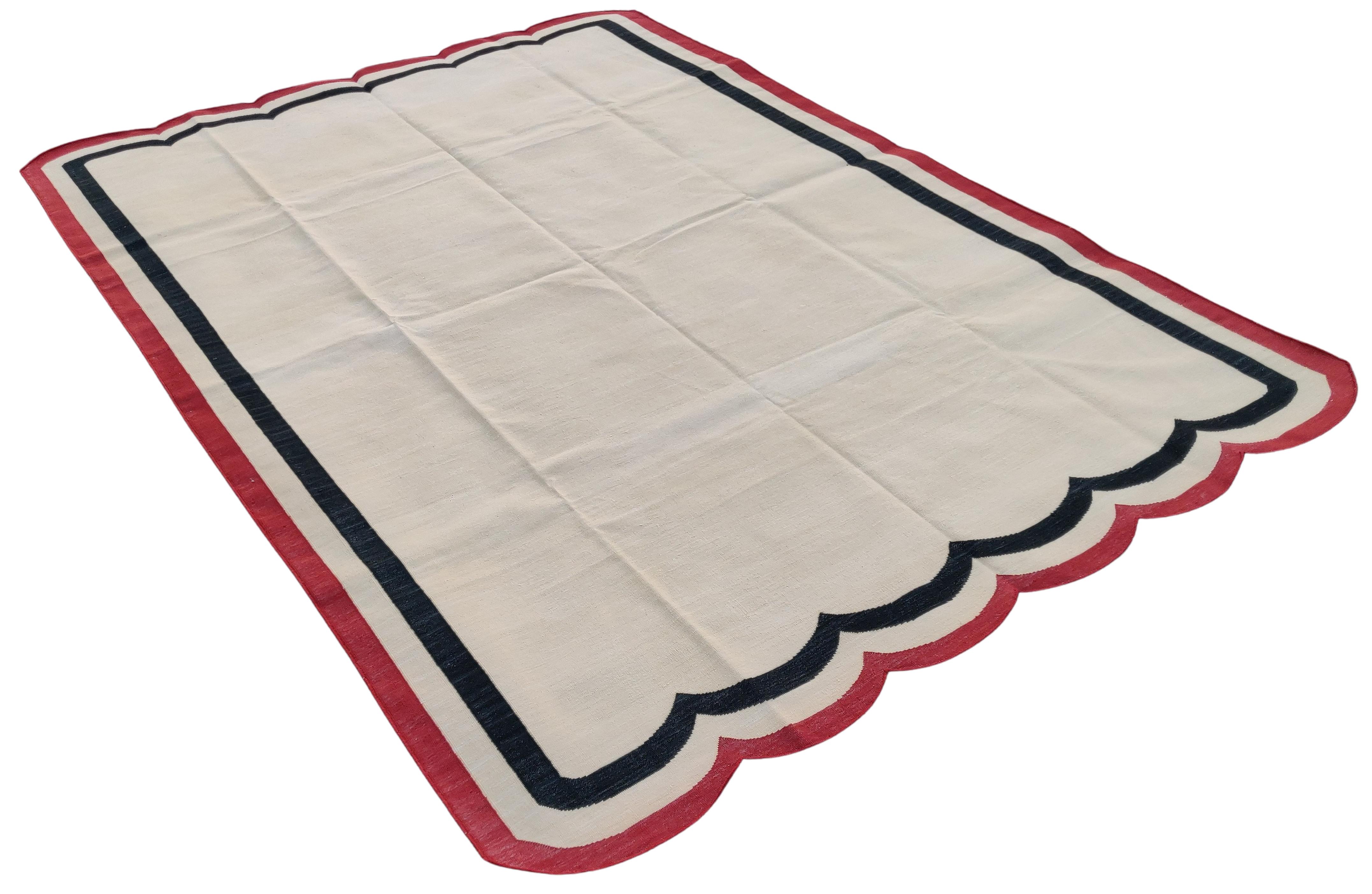 Cotton Vegetable Dyed Cream, Black And Red Two Sided Scalloped Rug-6'x9' 
(Scallops runs on 6 Feet Sides)
These special flat-weave dhurries are hand-woven with 15 ply 100% cotton yarn. Due to the special manufacturing techniques used to create our