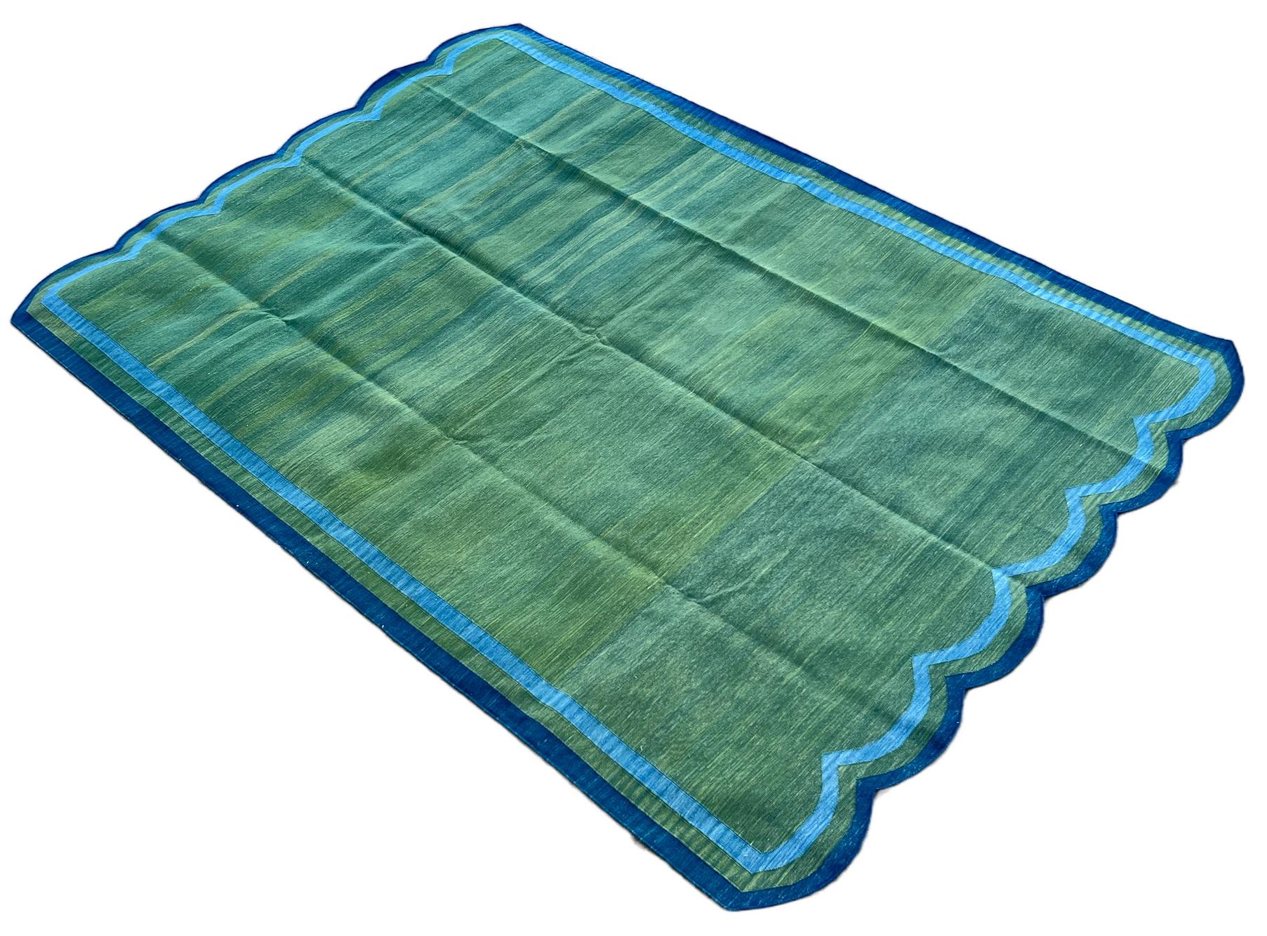 Cotton Vegetable Dyed Reversible Forest Green And Blue Indian Scalloped Rug - 6'x9'
These special flat-weave dhurries are hand-woven with 15 ply 100% cotton yarn. Due to the special manufacturing techniques used to create our rugs, the size and