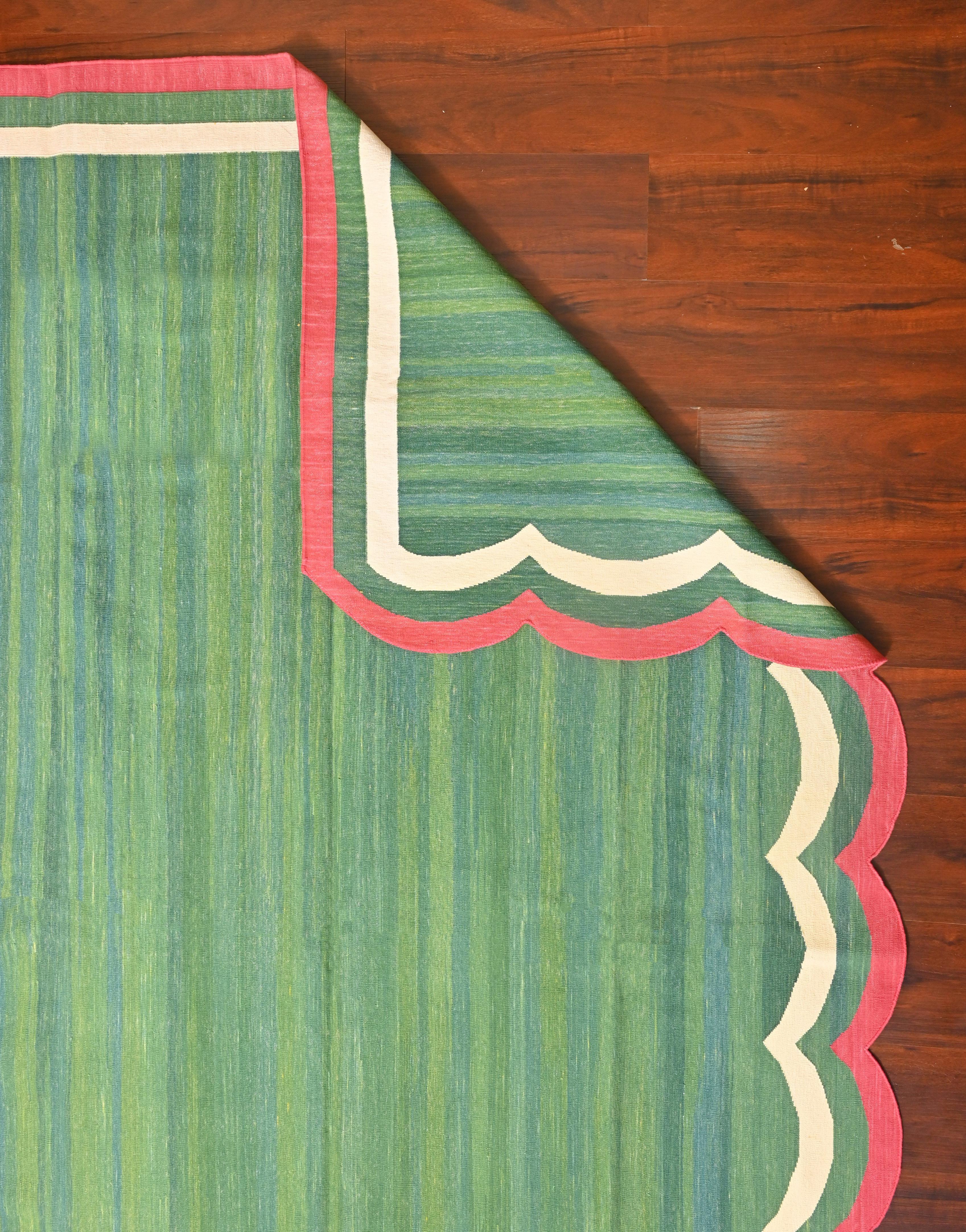 Cotton Vegetable Dyed Forest Green, Cream And Raspberry Pink Two Sided Scalloped Rug-6'x9' 
(Scallops runs on all 9 Feet Sides)
These special flat-weave dhurries are hand-woven with 15 ply 100% cotton yarn. Due to the special manufacturing