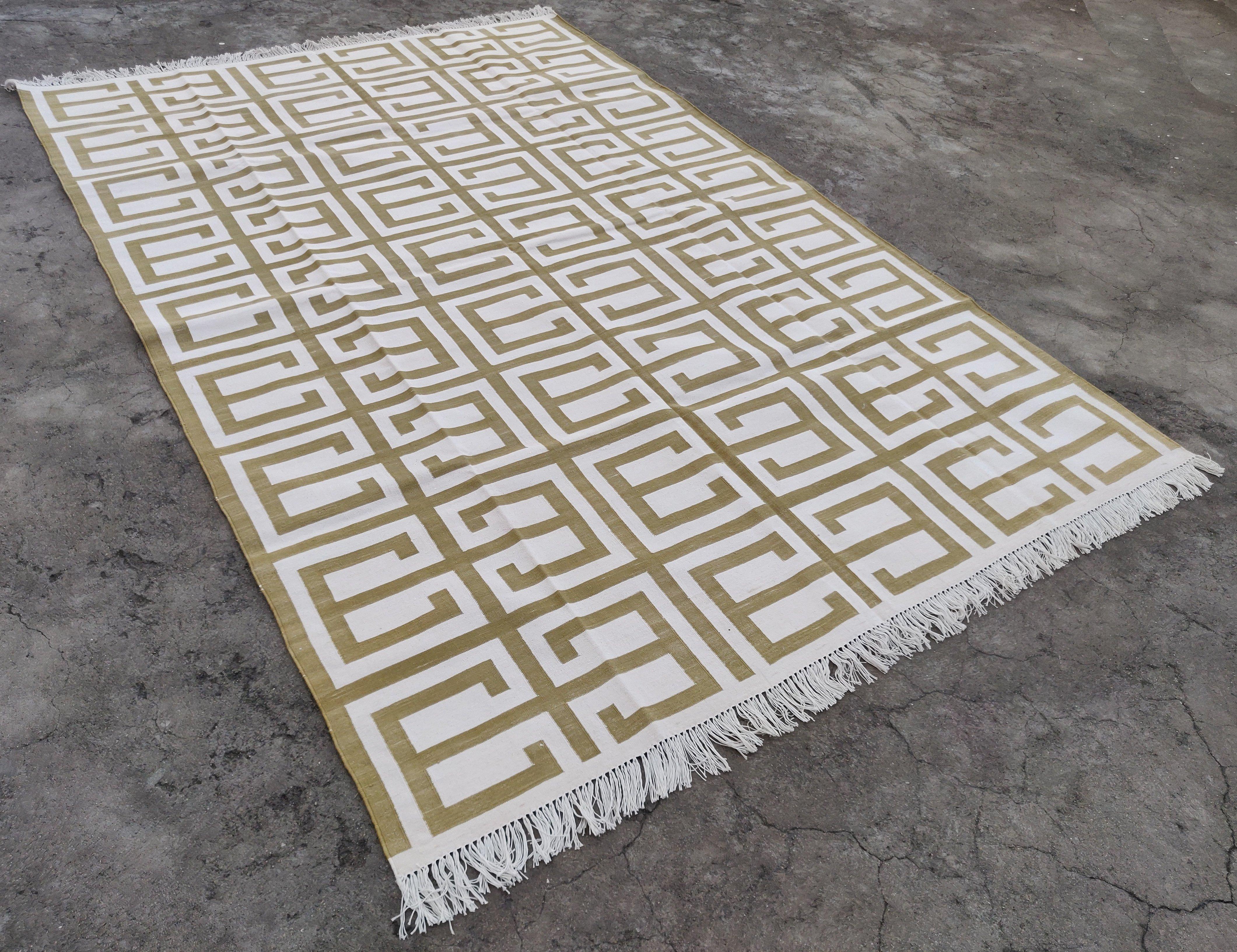 Cotton Vegetable Dyed Olive Green And Cream Geometric Indian Dhurrie Rug-6'x9' 
These special flat-weave dhurries are hand-woven with 15 ply 100% cotton yarn. Due to the special manufacturing techniques used to create our rugs, the size and color of