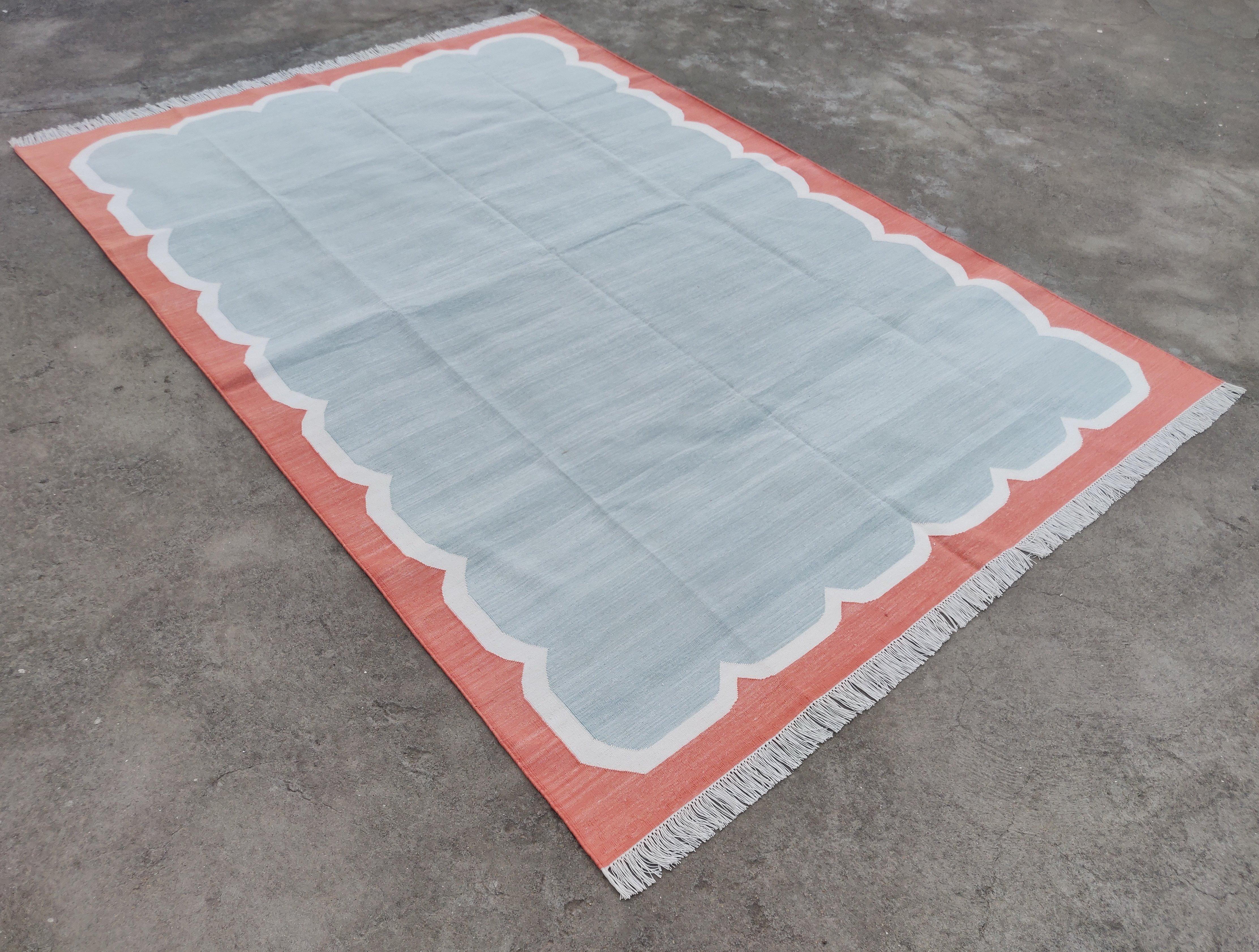 Cotton Vegetable Dyed Pale Aqua, Cream And Coral Scalloped Striped Indian Dhurrie Rug- 6'x9' (180x270cm) 

These special flat-weave dhurries are hand-woven with 15 ply 100% cotton yarn. Due to the special manufacturing techniques used to create our