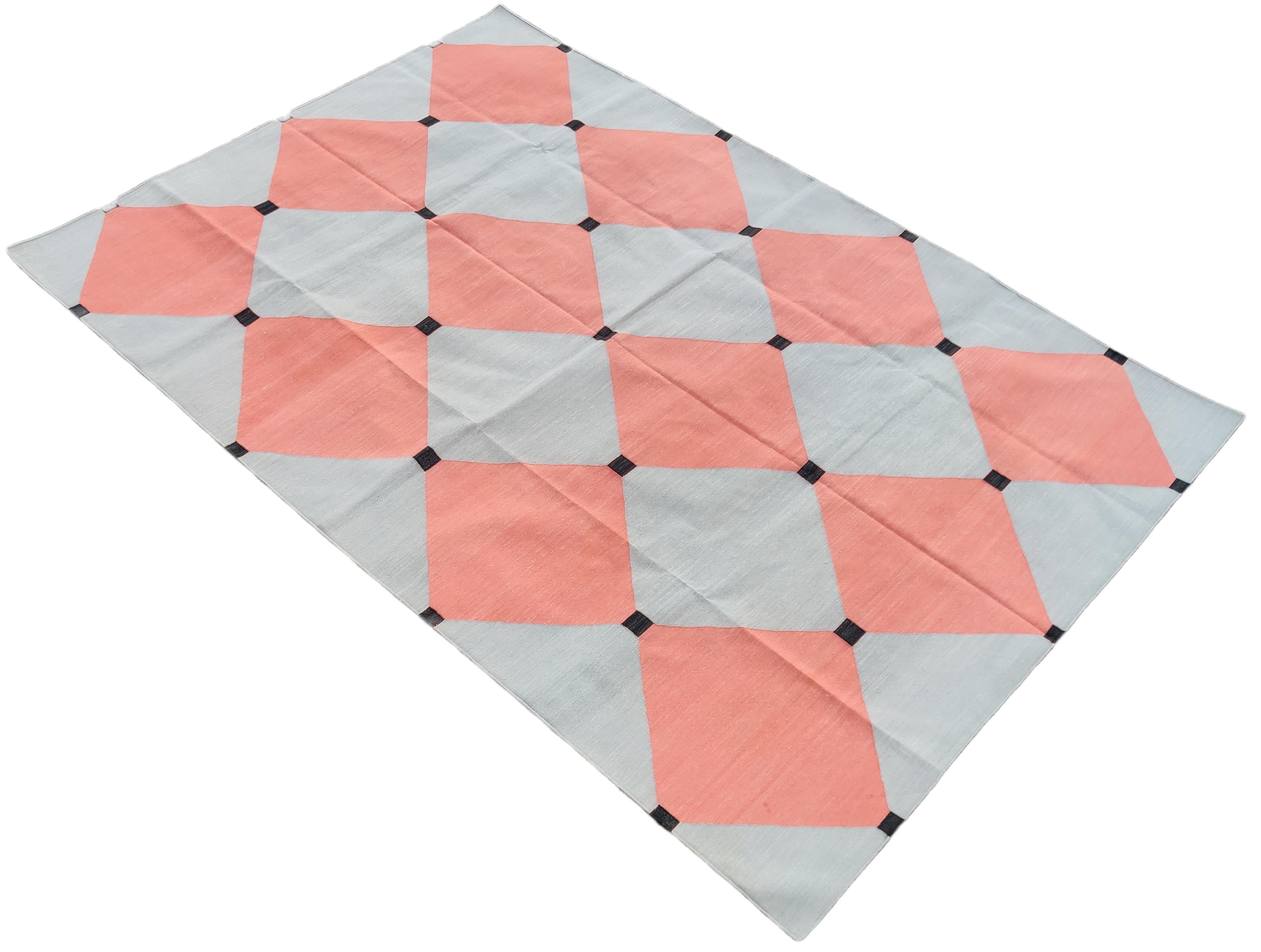 Cotton Vegetable Dyed Reversible Grey And Coral Indian Tile Checked Rug - 6'x9'
These special flat-weave dhurries are hand-woven with 15 ply 100% cotton yarn. Due to the special manufacturing techniques used to create our rugs, the size and color of
